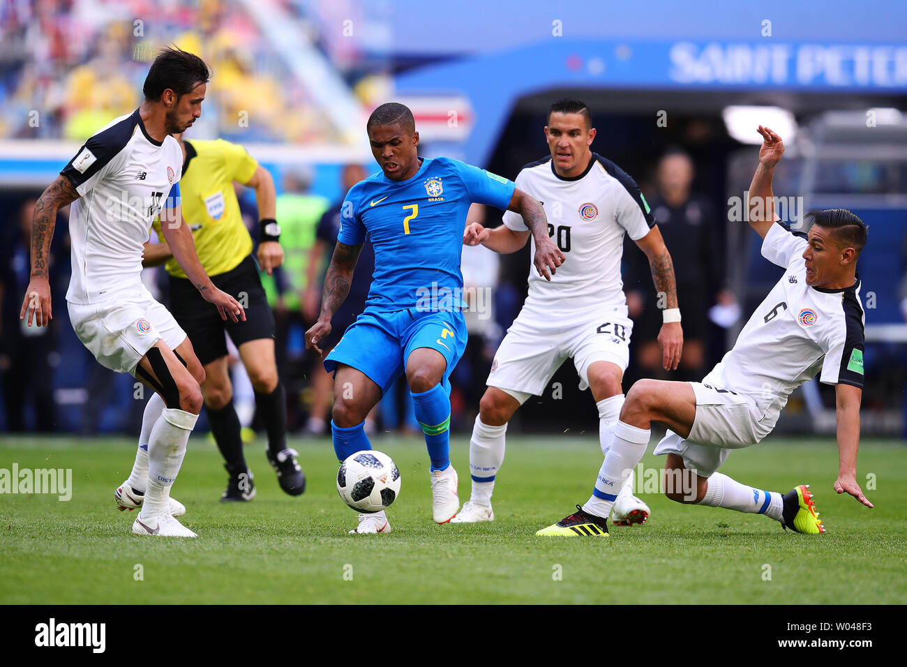 Douglas Costa (C) of Brazil in action with Bryan Ruiz (L) and Oscar Duarte of Costa Rica during the 2018 FIFA World Cup Group E match at the Saint Petersburg Stadium in Saint Petersburg, Russia on June 22, 2018. Photo by Chris Brunskill/UPI Stock Photo