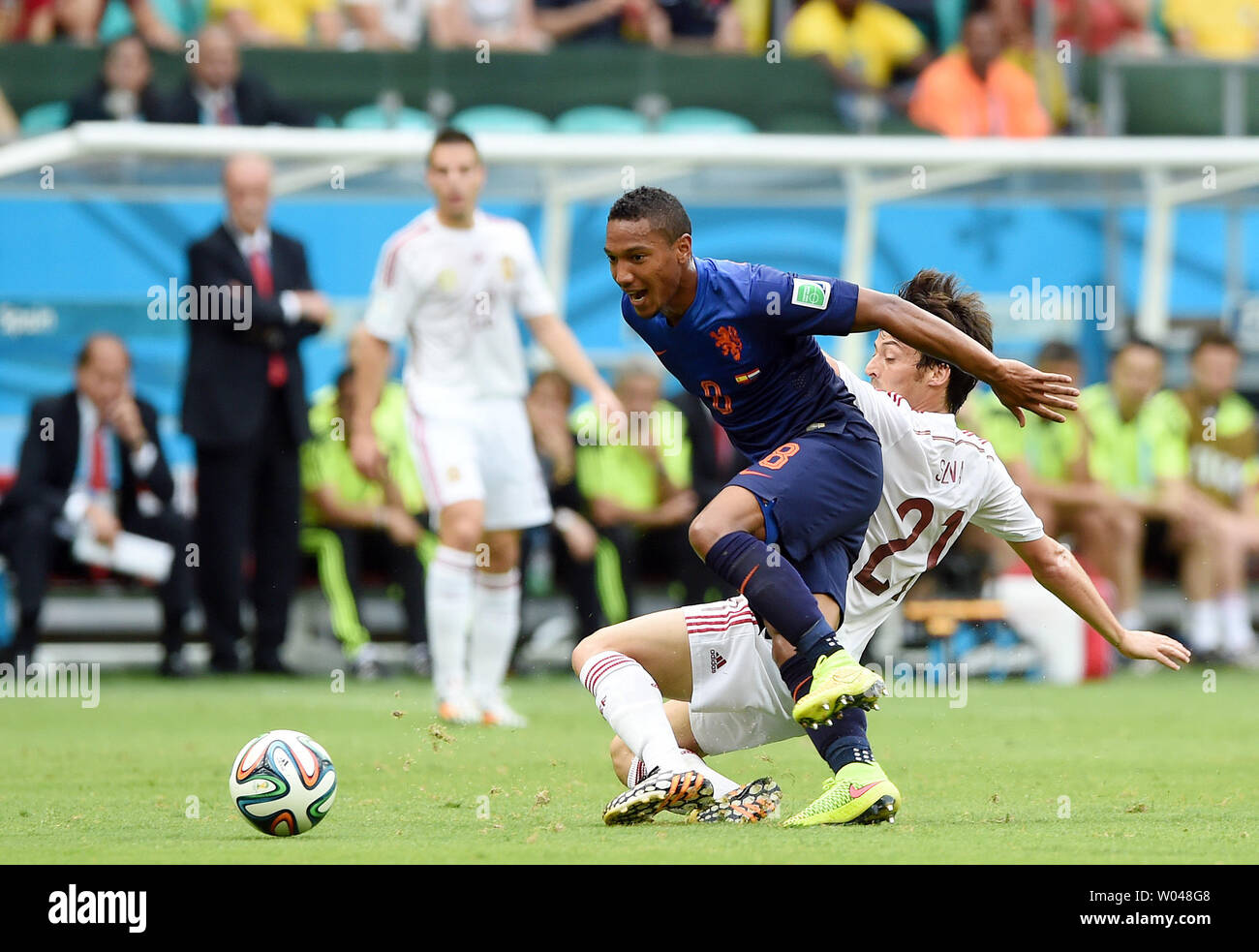 David Silva of Spain competes with Jonathan De Guzman (L) of the Netherlands during the 2014 FIFA World Cup Group B match at the Arena Fonte Nova in Salvador, Brazil on June 13, 2014. UPI/Chris Brunskill Stock Photo