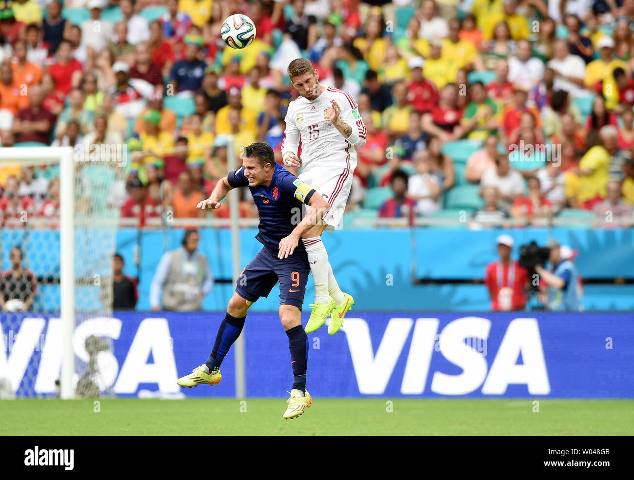 Sergio Ramos of Spain jumps with Robin Van Persie (L) of the Netherlands during the 2014 FIFA World Cup Group B match at the Arena Fonte Nova in Salvador, Brazil on June 13, 2014. UPI/Chris Brunskill Stock Photo