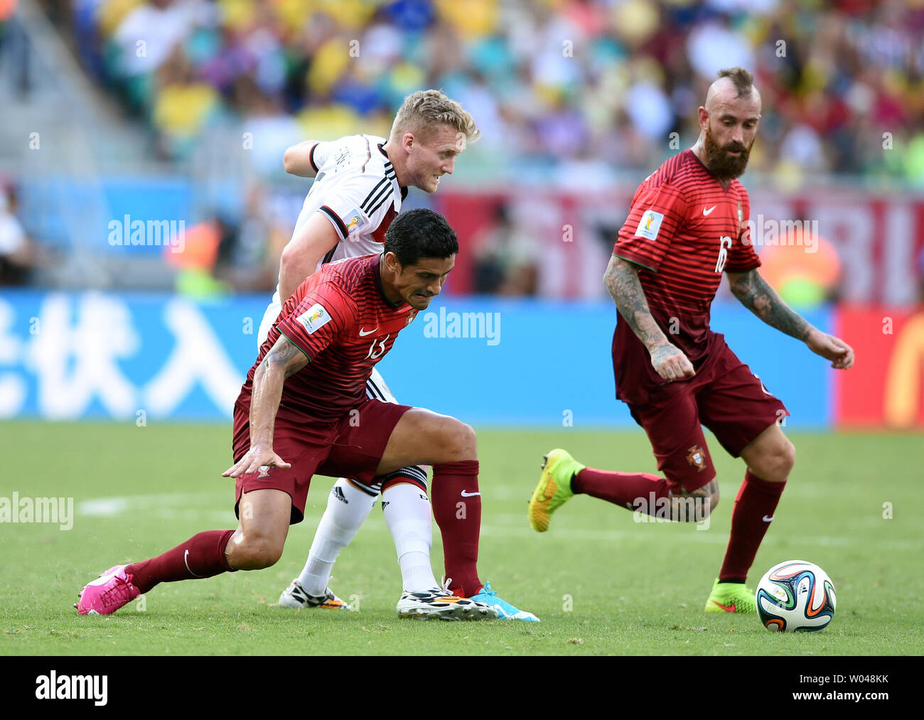 Andre Schurrle (L) of Germany competes with Ricardo Costa of Portugal during the 2014 FIFA World Cup Group G match at the Arena Fonte Nova in Salvador, Brazil on June 16, 2014. UPI/Chris Brunskill Stock Photo