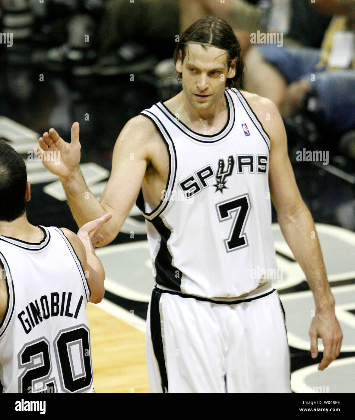 San Antonio Spurs guard Manu Ginobili (L) congratulates San Antonio Spurs Fabricio Oberto (R) after a key defensive stop against the Utah Jazz in the second half of game two of the NBA Western Conference finals at AT&T Center in San Antonio on May 22, 2007. The Spurs defeated the Jazz 105-96 to take a 2-0 lead in the best of seven series. (UPI Photo/Aaron M. Sprecher) Stock Photo