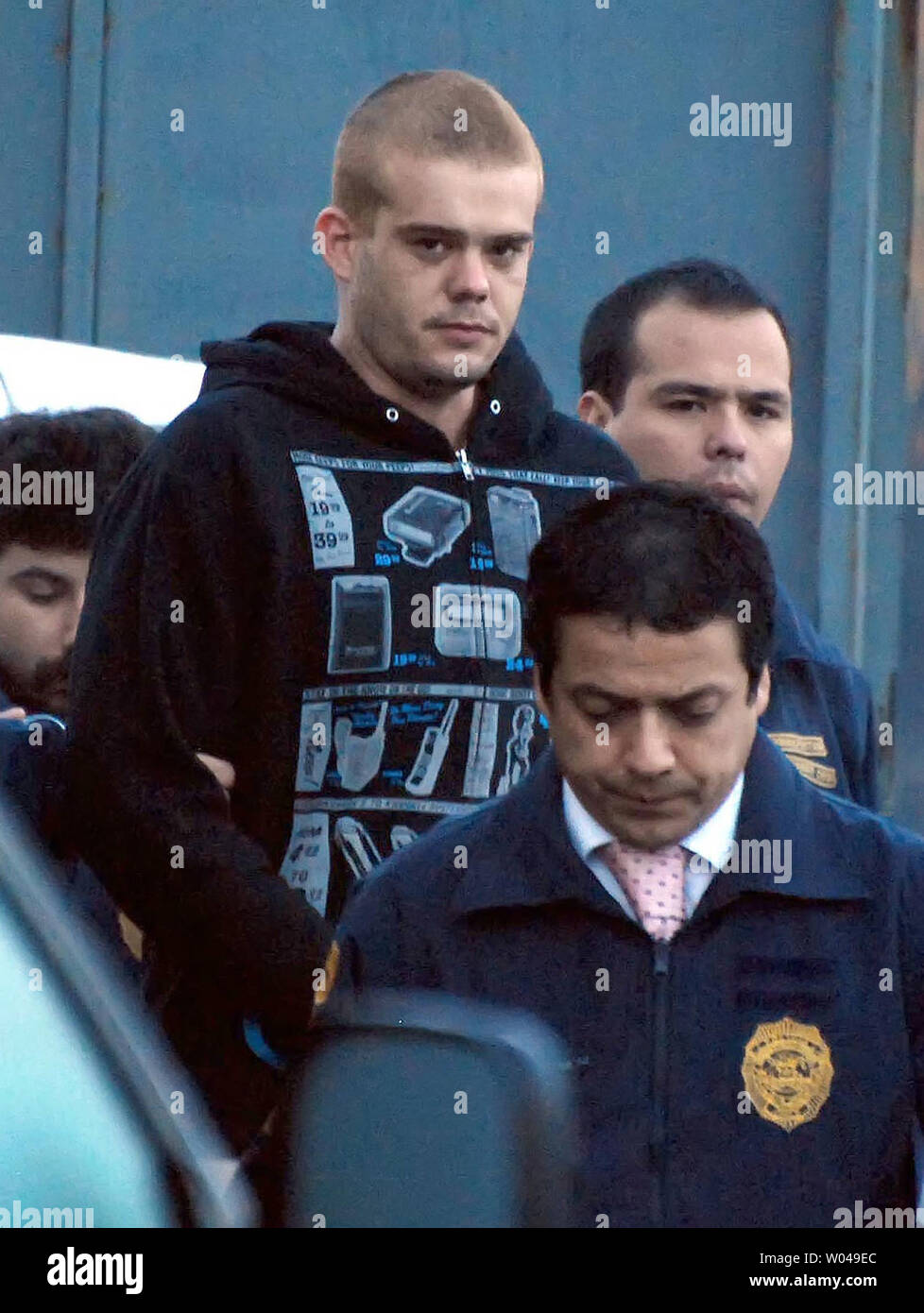Dutch murder suspect Joran van der Sloot is escorted by Chilean police to an awaiting plane in Santiago, Chile, on June 4, 2010.  He was to be flown to northern Chile and then transferred overland to Peruvian authorities.  He is expected to be charged with the killing of 21-year-old Stephany Flores in a Lima, Peru hotel room. The 23-year-old van der Sloot, a citizen of the Netherlands, remains the prime suspect in the disappearance of Natalie Holloway, and Alabama teenager, on the island of Aruba in 2005.   UPI/Dinko Eichin Stock Photo