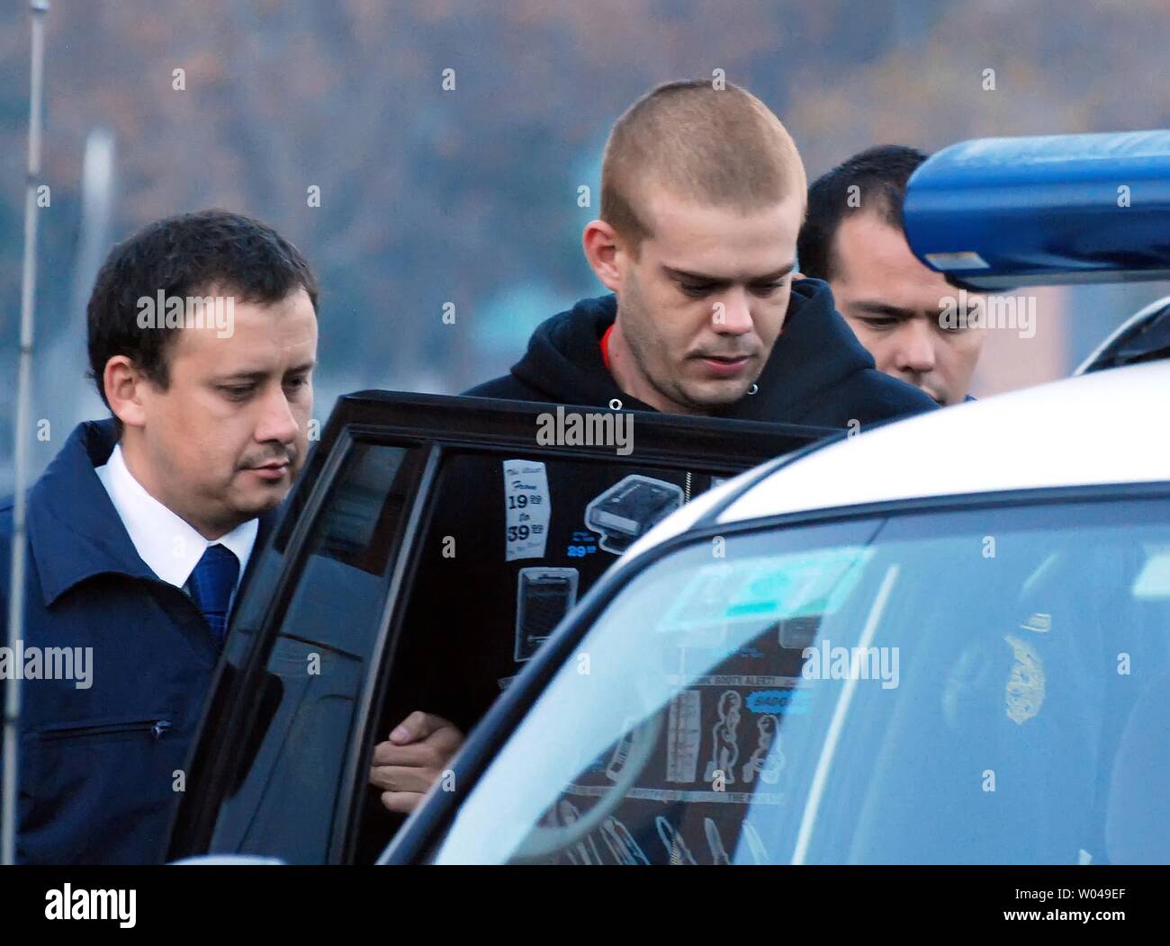 Dutch murder suspect Joran van der Sloot is escorted by Chilean police to an awaiting plane in Santiago, Chile, on June 4, 2010.  He was to be flown to northern Chile and then transferred overland to Peruvian authorities.  He is expected to be charged with the killing of 21-year-old Stephany Flores in a Lima, Peru hotel room. The 23-year-old van der Sloot, a citizen of the Netherlands, remains the prime suspect in the disappearance of Natalie Holloway, and Alabama teenager, on the island of Aruba in 2005.   UPI/Dinko Eichin Stock Photo