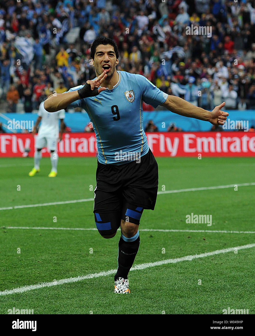 Luis Suarez of Uruguay celebrates scoring the opening goal during the 2014 FIFA World Cup Group D match at the Arena Corinthians in Sao Paulo, Brazil on June 19, 2014. UPI/Chris Brunskill Stock Photo