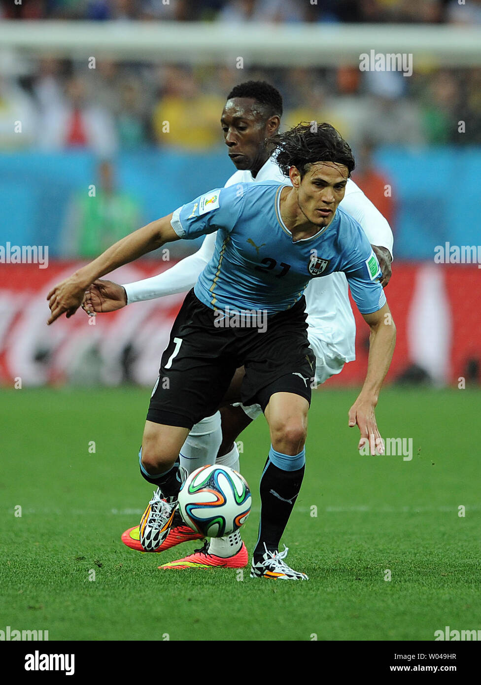 Edinson Cavani (L) of Uruguay competes with Danny Welbeck of England during the 2014 FIFA World Cup Group D match at the Arena Corinthians in Sao Paulo, Brazil on June 19, 2014. UPI/Chris Brunskill Stock Photo