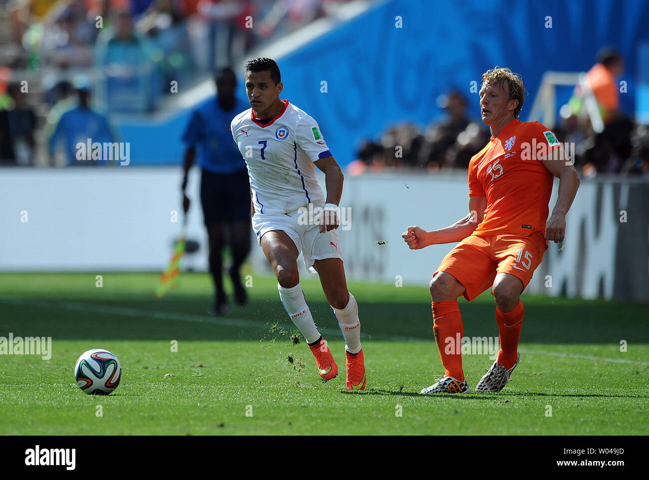 Dirk Kuyt of the Netherlands competes with Alexis Sanchez (L) of Chile during the 2014 FIFA World Cup Group B match at the Arena Corinthians in Sao Paulo, Brazil on June 23, 2014. UPI/Chris Brunskill Stock Photo