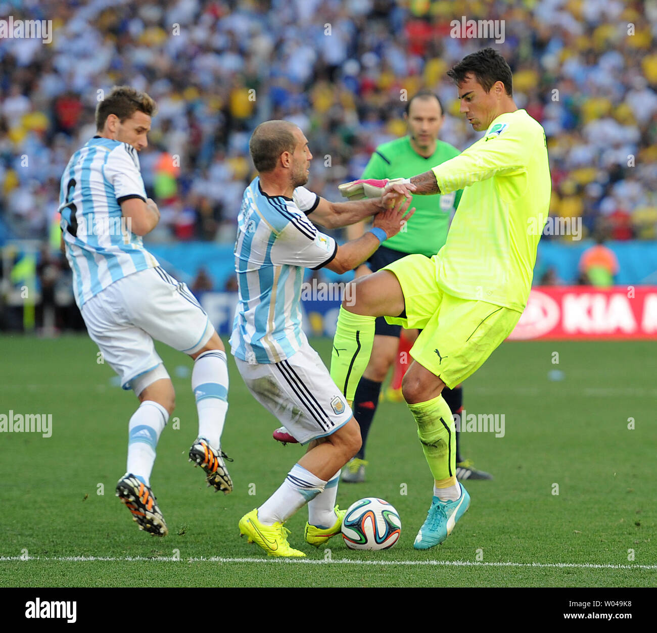 Pablo Zabaleta (C) of Argentina competes with Diego Benaglio of Switzerland during the 2014 FIFA World Cup Round of 16 match at the Arena Corinthians in Sao Paulo, Brazil on July 01, 2014. UPI/Chris Brunskill Stock Photo