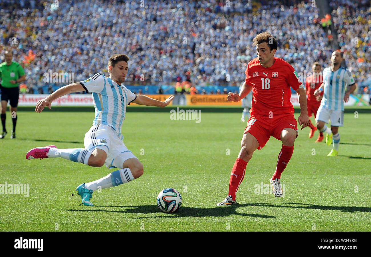 Federico Fernandez (L) of Argentina competes with Admir Mehmedi of Switzerland during the 2014 FIFA World Cup Round of 16 match at the Arena Corinthians in Sao Paulo, Brazil on July 01, 2014. UPI/Chris Brunskill Stock Photo
