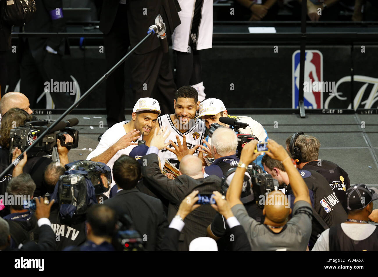 From left to right San Antonio Spurs guard Tony Parker (9), forward Tim Duncan (21) and guard Manu Ginobili (20) celebrate with the Larry O'Brien trophy after defeating the Miami Heat following game 5 of the NBA Finals at the AT&T Center at the AT&T Center in San Antonio, Texas on June 15, 2014. The Spurs defeated the Heat 104-87 to win the best of seven series 4-1.     UPI/Aaron M. Sprecher Stock Photo