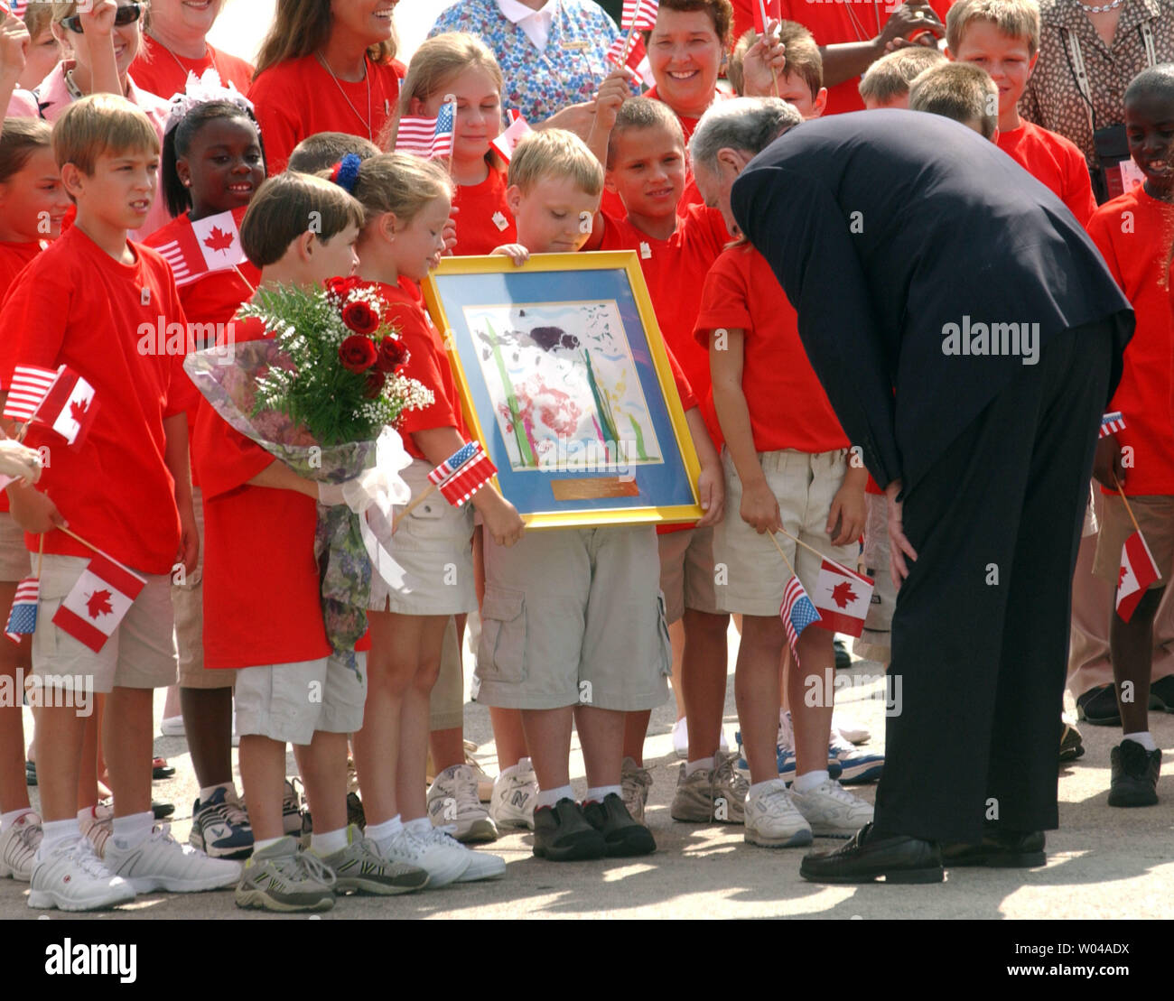 Canadian Prime Minister Paul Martin is welcomed to Georgia and the G8 Summit by children from the Satilla Marsh Elementary School on June 8, 2004 in Savannah, Georgia.  Leaders from the eight largest democratic economies in the world are meeting in Savannah for their annual meetings. (UPI Photo/Michael Kleinfeld) Stock Photo