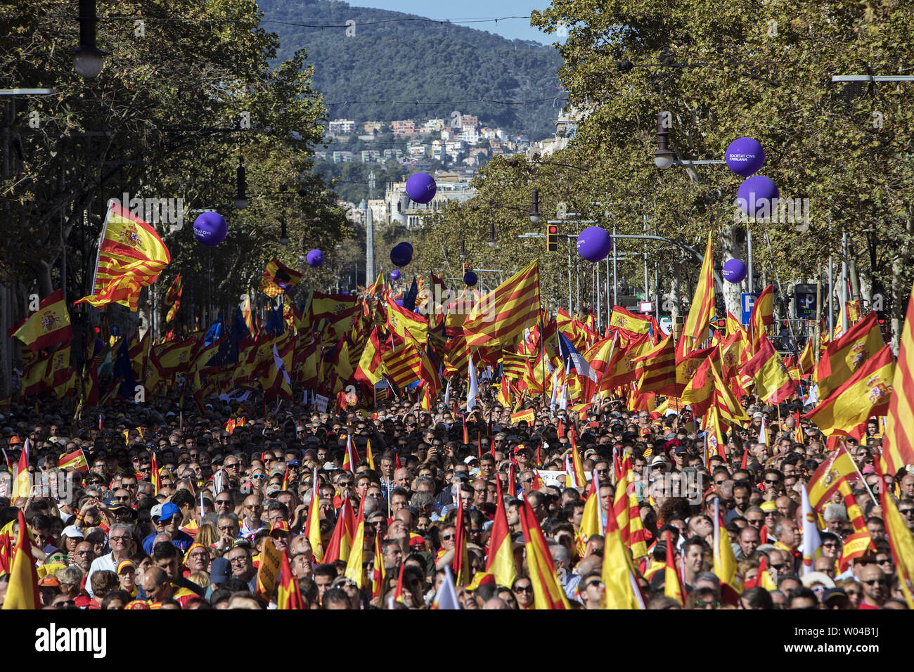 Protesters wave Spanish flags during a pro-unity demonstration in Barcelona on October 29, 2017. Pro-unity protesters were to gather in Catalonia's capital Barcelona, two days after lawmakers voted to split the wealthy region from Spain, plunging the country into an unprecedented political crisis. photo by Xavi Herrero/ UPI Stock Photo