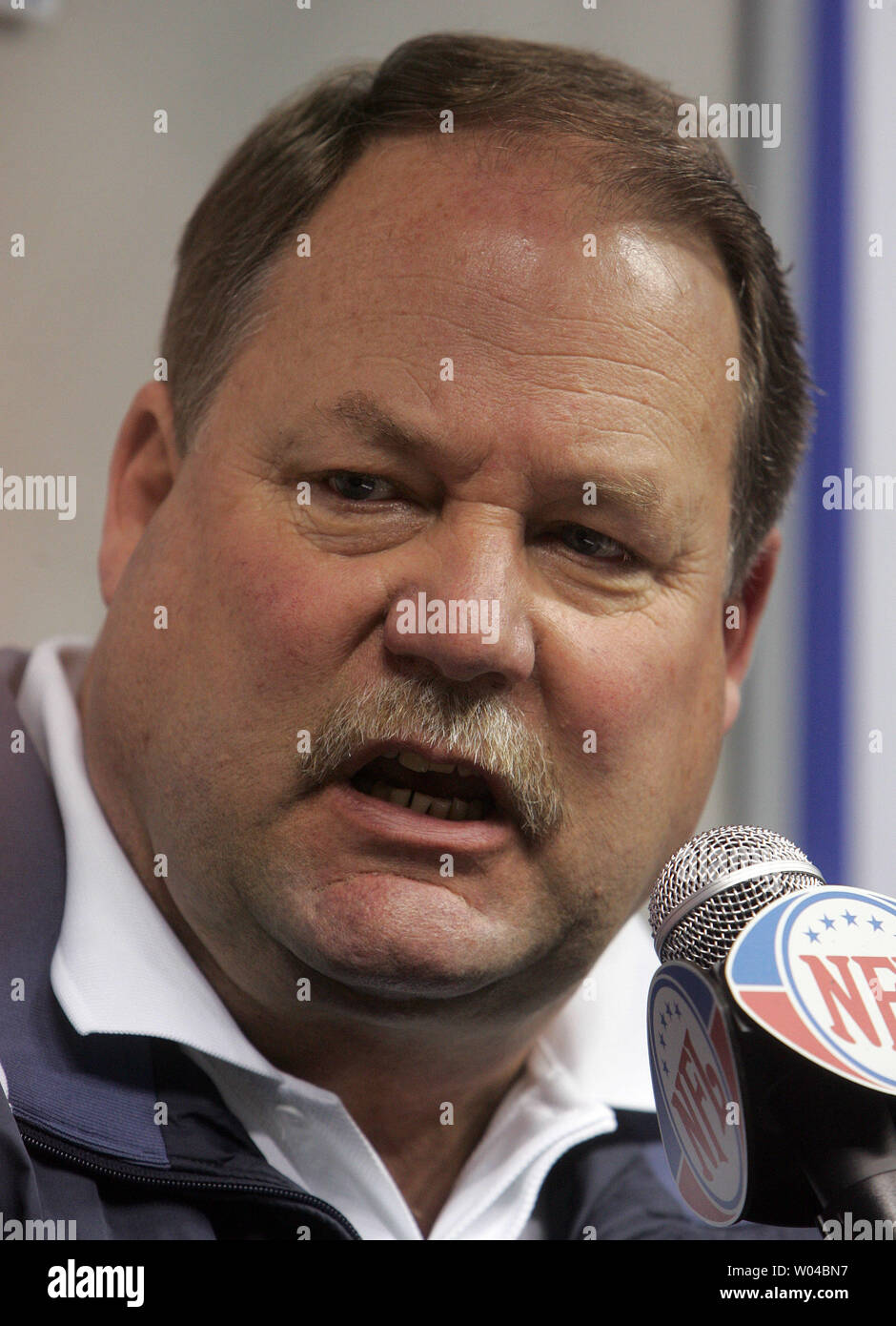 Seahawks head coach Mike Holmgren, wearing his 1997 Super Bowl XXXI Championship  ring, answers questions from the media during the Seattle Seahawks' Superl  Bowl XL Media Day at Ford Field in Detroit