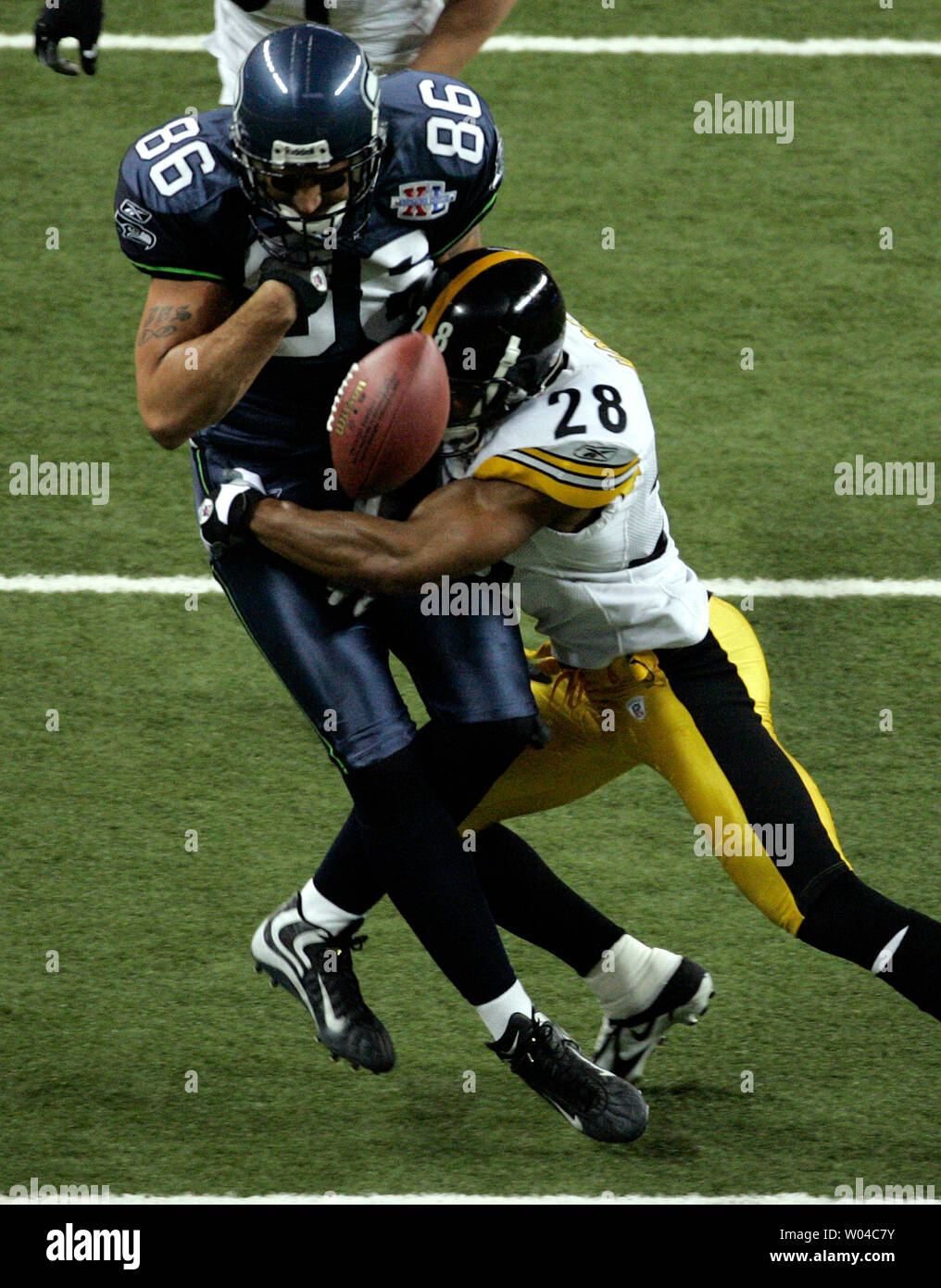 Jerramy Stevens of the Seattle Seahawks drops the pass as he is tackled by Pittsburgh Steelers safety Chris Hope in the second quarter of Super Bowl XL featuring the Seattle Seahawks and the Pittsburgh Steelers at Ford Field in Detroit, Mi., on February 5, 2006.  (UPI Photo/Gary Caskey) Stock Photo