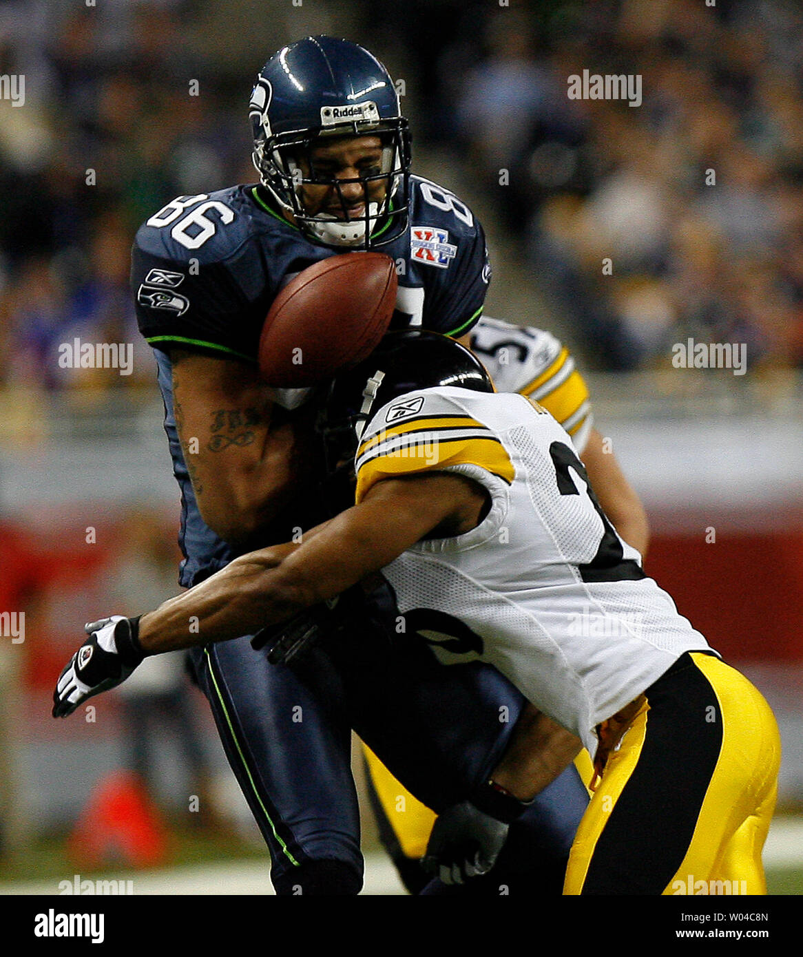 Jerramy Stevens of the Seattle Seahawks drops the pass as he is tackled by Pittsburgh Steelers safety Chris Hope in the second half of Super Bowl XL featuring the Seattle Seahawks and the Pittsburgh Steelers at Ford Field in Detroit, Mi., on February 5, 2006.  (UPI Photo/John Angelillo) Stock Photo