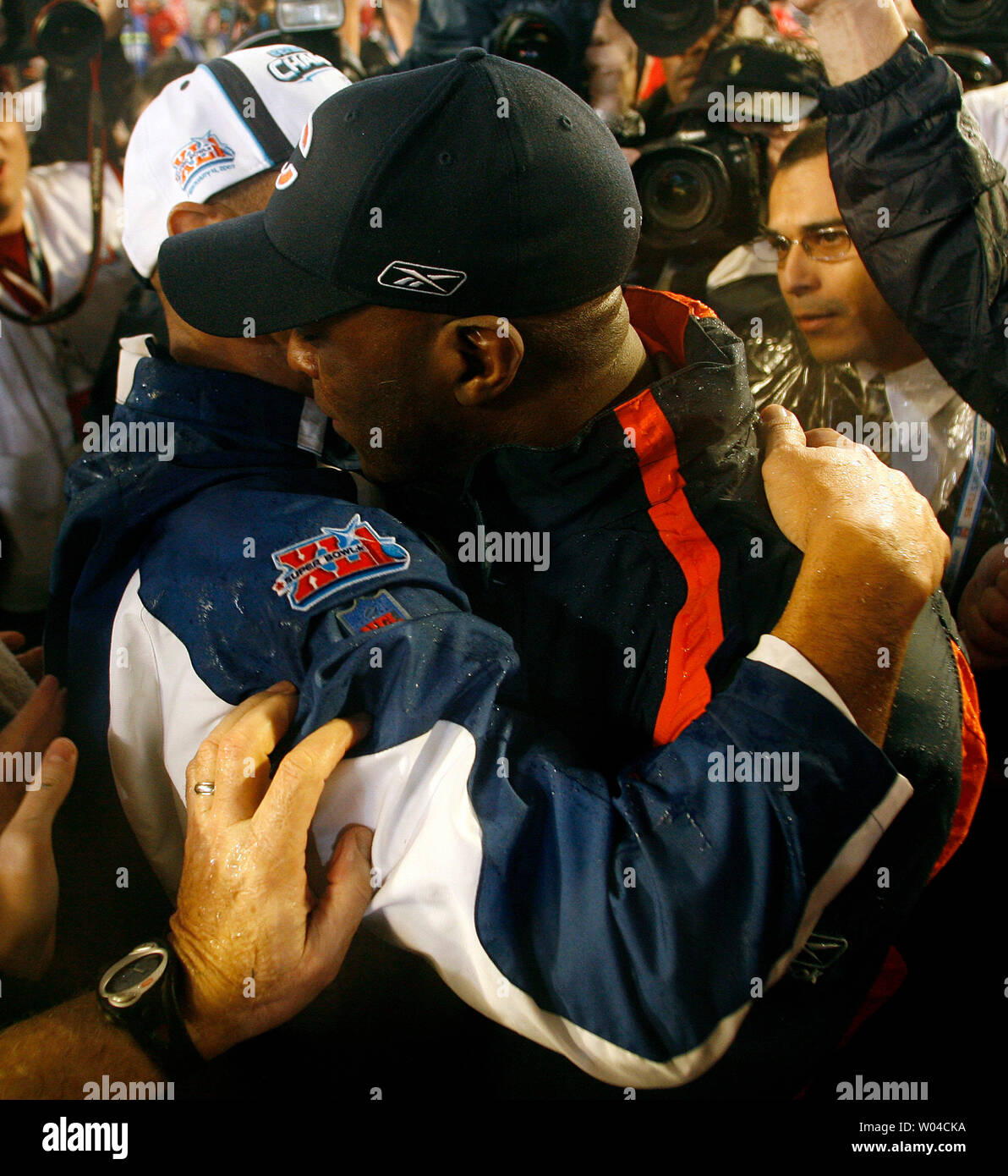 Indianapolis Colts Head Coach Tony Dungy embraces Chicago Bears Head Coach Lovie Smith on the Colts 29 to 17 win over the Bears in a rainy Super Bowl XLI at Dolphin Stadium in Miami on February 4, 2007. The Colts defeated the Bears 29-17.  (UPI Photo/Gary C. Caskey) Stock Photo