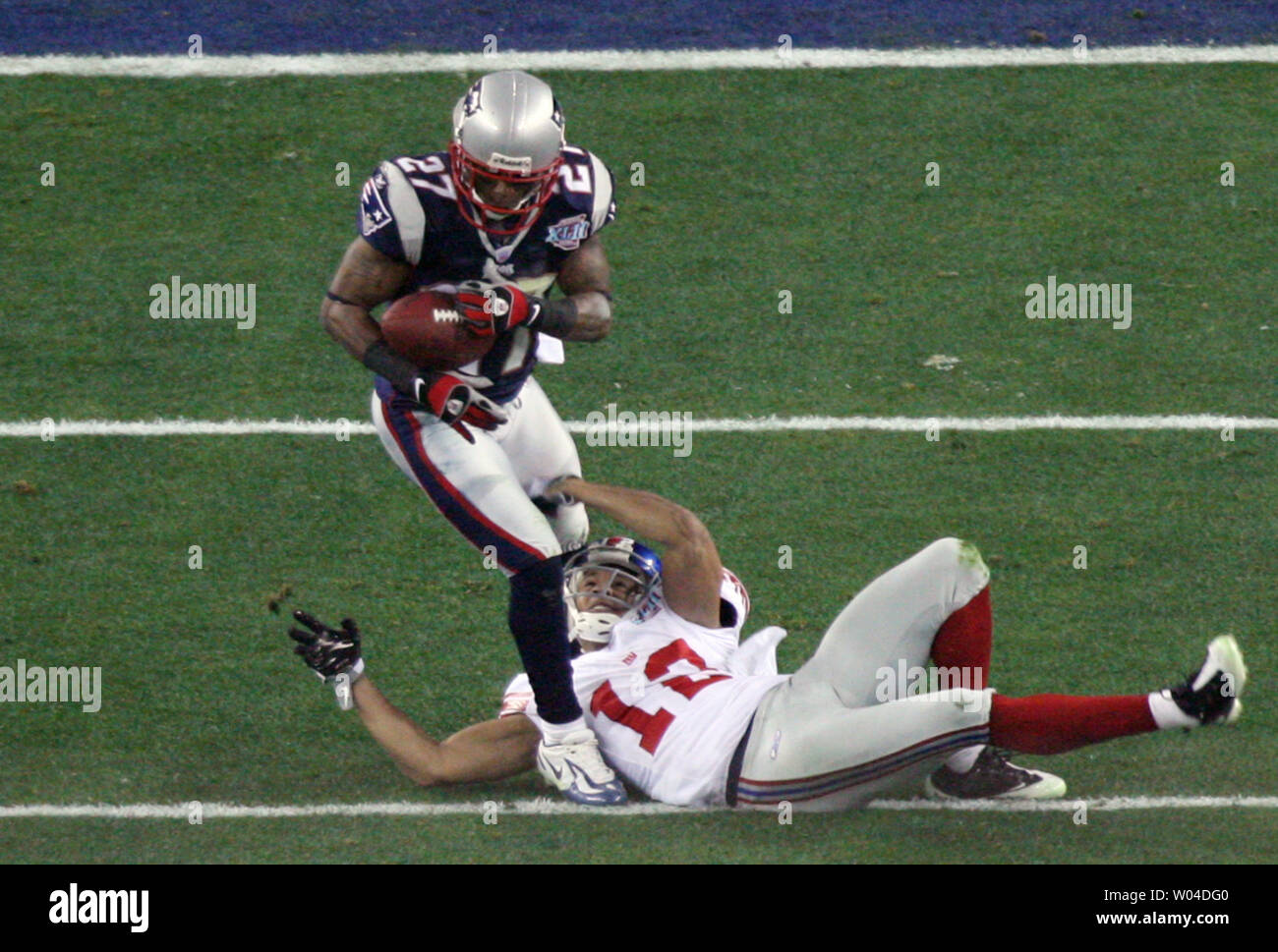 New England Patriots cornerback Ellis Hobbs III (L) intercepts a pass intended for New York Giants wide receiver Steve Smith (12) in the second quarter during Super Bowl XLII at University of Phoenix Stadium in Glendale, Arizona on February 3, 2008. (UPI Photo/Art Foxall) Stock Photo