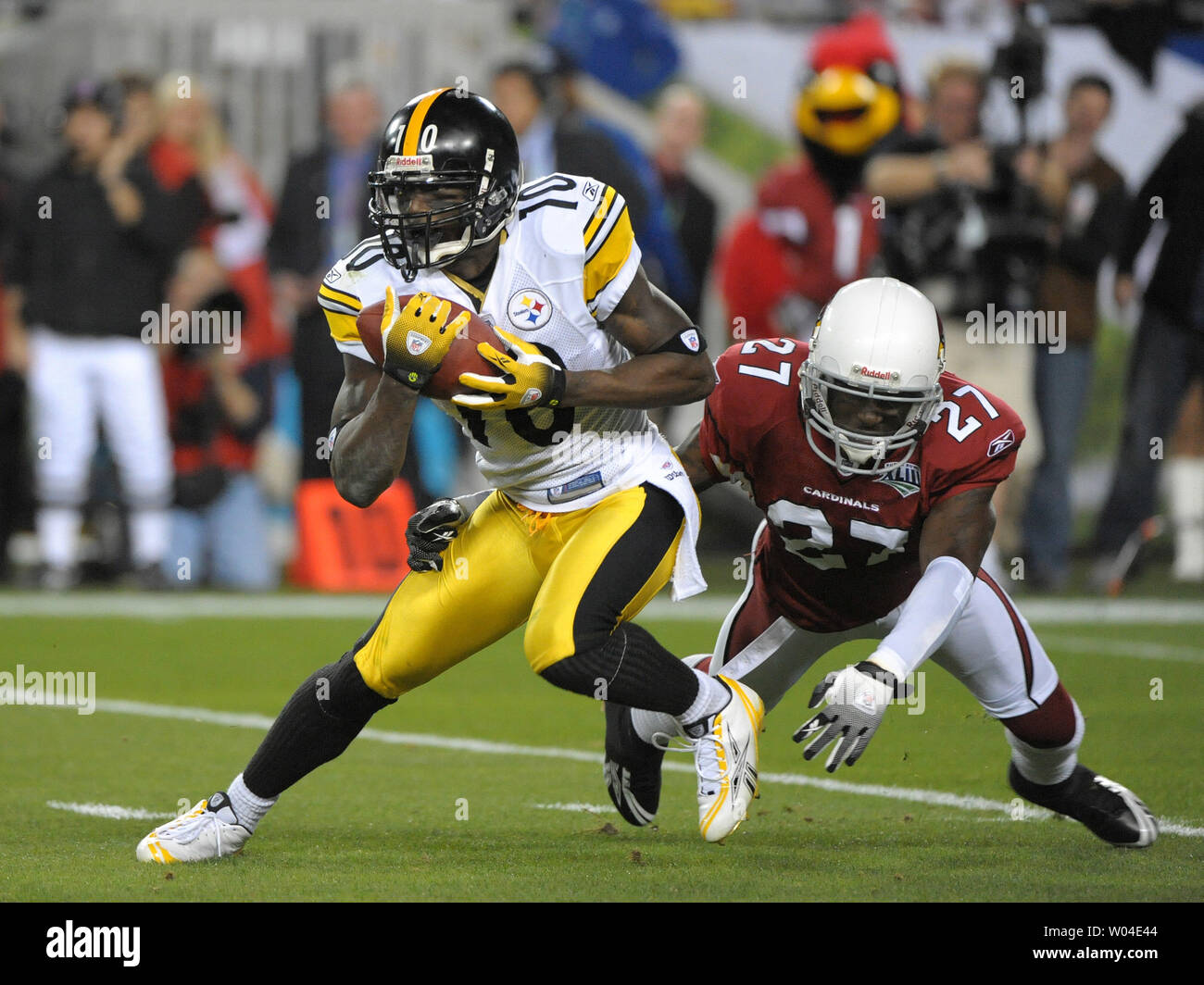 Pittsburgh Steelers Santonio Holmes returns a punt for one yard against Arizona Cardinals defender Michael Adams in the second quarter at Super Bowl XLIII at Raymond James Stadium in Tampa, Florida, on February 1, 2009. (UPI Photo/Kevin Dietsch) Stock Photo
