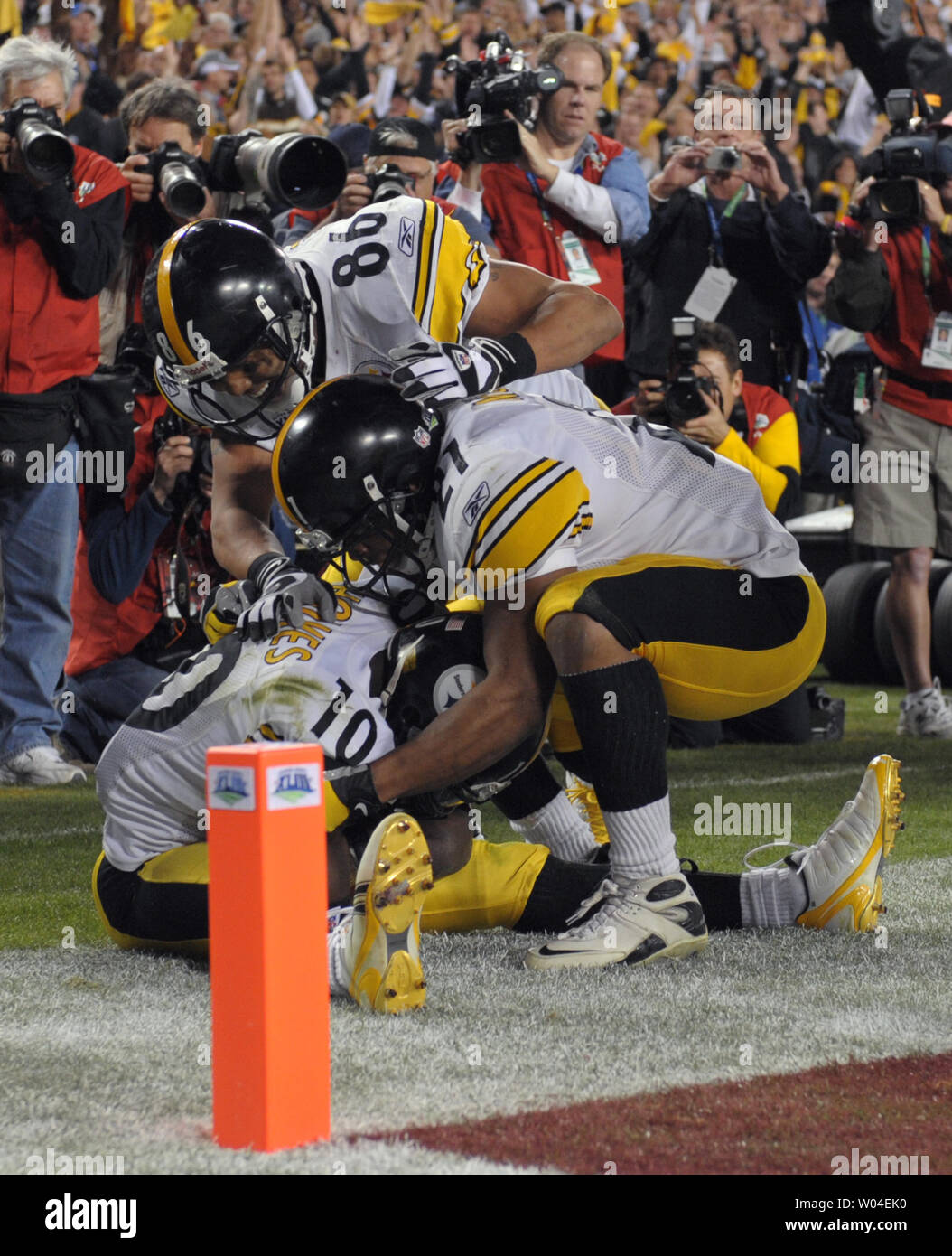 Pittsburgh Steelers Hines Ward (top) and Mewelde Moore celebrate with wide receiver Santonio Holmes after he pulled in the game-winning touchdown reception against the Arizona Cardinals in the fourth quarter at Super Bowl XLIII at Raymond James Stadium in Tampa, Florida, on February 1, 2009. The Steelers defeated the Cardinals 27-23.   (UPI Photo/Kevin Dietsch) Stock Photo