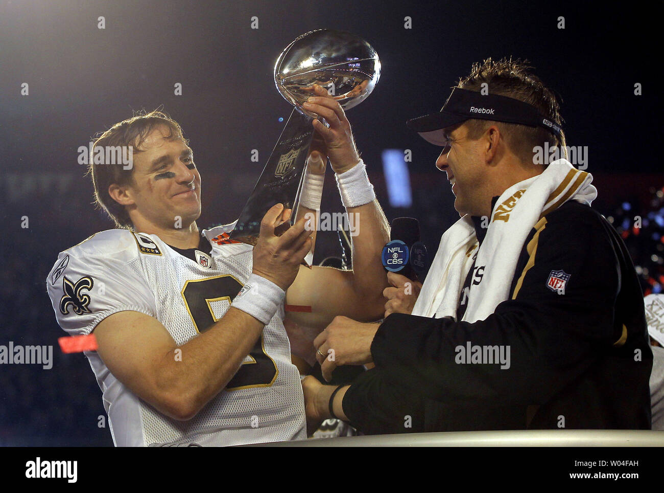New Orleans Saints head coach Sean Payton watches as New Orleans Saints  quarter back Drew Brees holds aloft the Vince Lombardi Trophy after the  Saints defeated the Indianapolis Colts 31-17 in Super