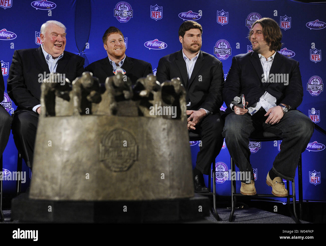 John Madden (L) presents the Madden Most Valuable Protectors Award to the New England Patriots, represented by Dan Koppen, Dan Connolly and Mark LeVoir (L to R), after they were named the year's best offensive line during the week of Super Bowl XLV in Dallas, Texas, on February 3, 2011. The Pittsburgh Steelers will take on the Green Bay Packers on February 6, 2011.    UPI/Roger L. Wollenberg Stock Photo