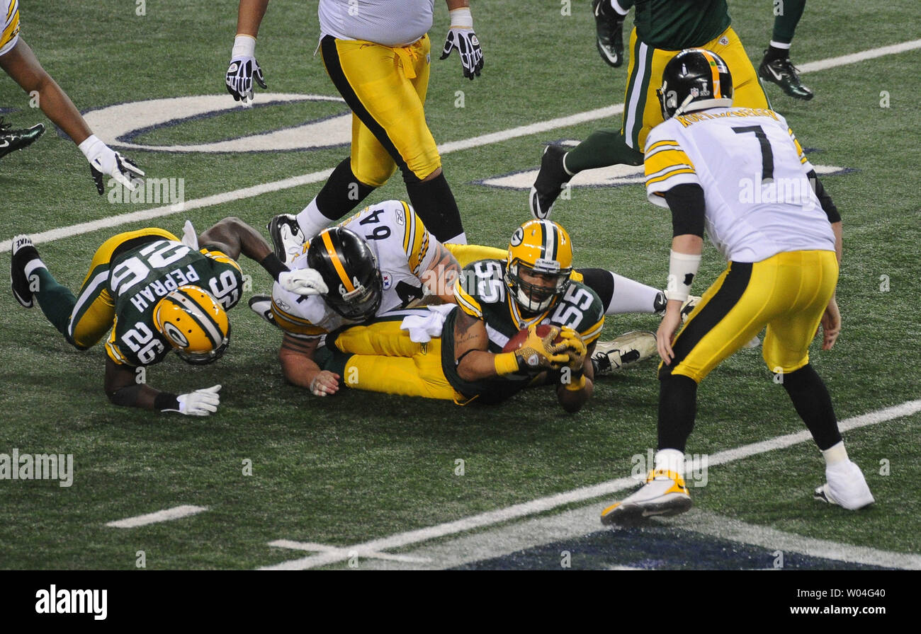 Pittsburgh Steelers runningback Rashard Mendenhall is tackled by Green Bay  Packers cornerback Charles Woodson in the first half during Super Bowl XLV  at Cowboys Stadium in Arlington, Texas on February 6, 2011.