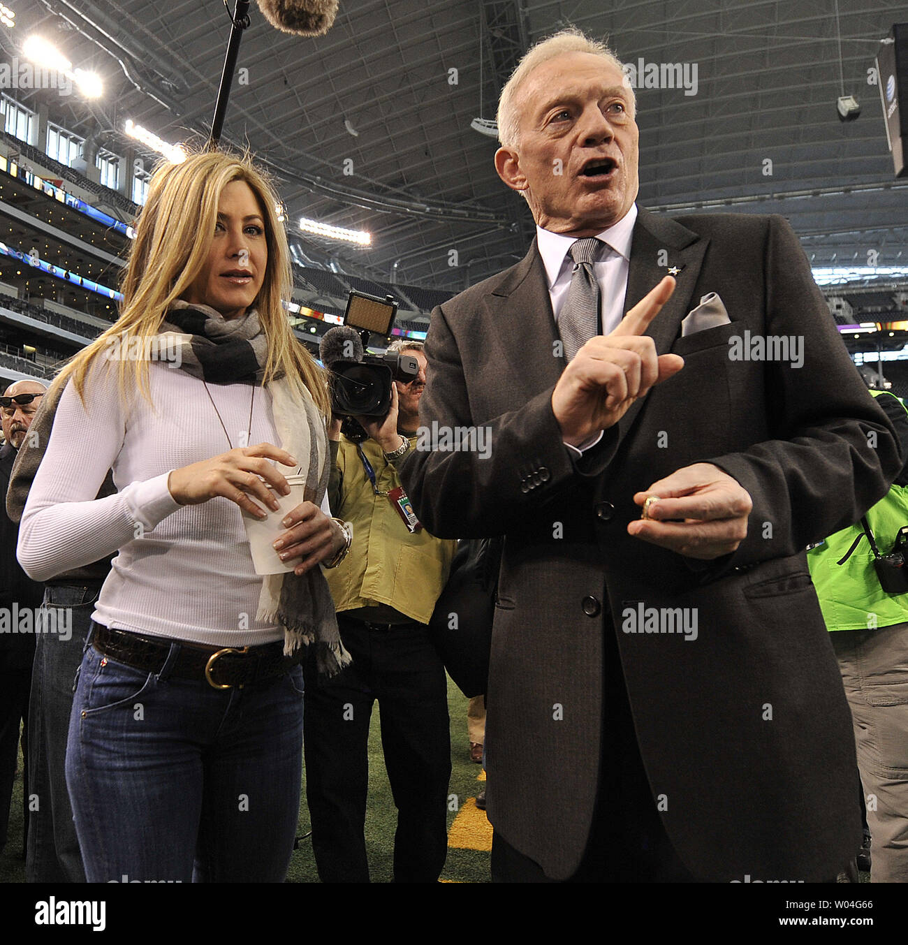 Actress Jennifer Aniston and Dallas Cowboys owner Jerry Jones talk during Super Bowl XLV pre-game activities at Cowboys Stadium in Arlington, Texas  on February 6, 2011.     UPI/Brian Kersey Stock Photo