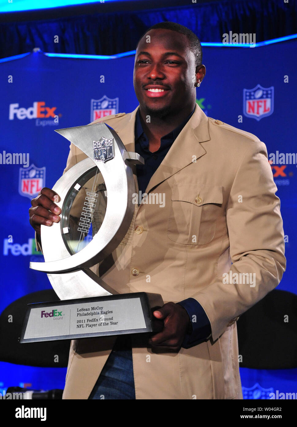 Philadelphia Eagles running back LeSean McCoy poses with the FedEx 2011  Ground NFL Player of the Year award at the awards ceremony in Indianapolis  during Super Bowl week on February 1, 2012