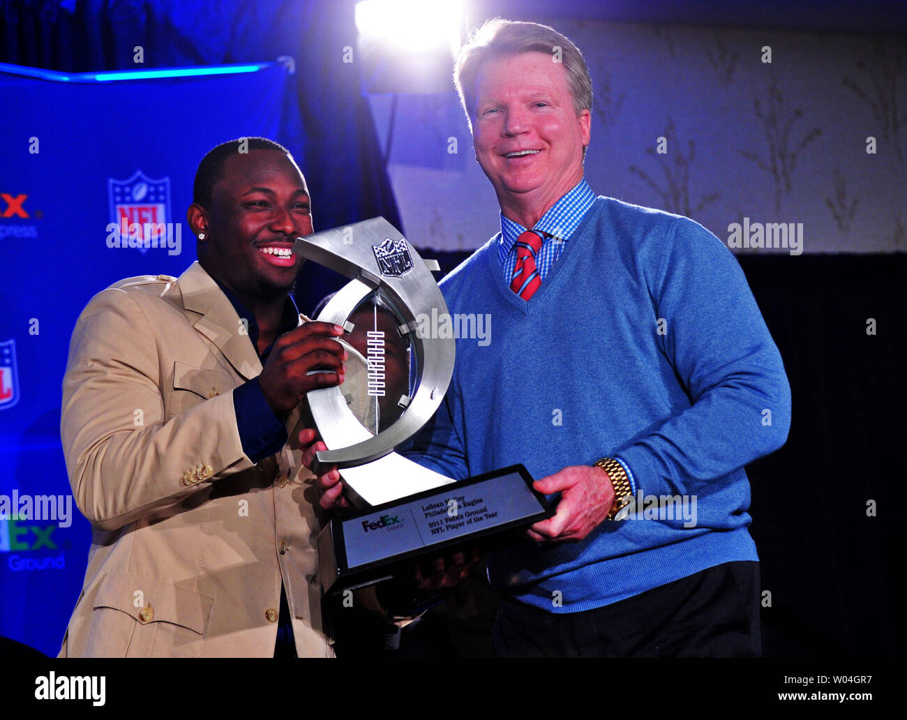 Philadelphia Eagles running back LeSean McCoy receives the FedEx 2011 Ground NFL Player of the Year award from commentator Phil Simms during a ceremony in Indianapolis during Super Bowl week on February 1, 2012, 2012.  UPI/Kevin Dietsch Stock Photo