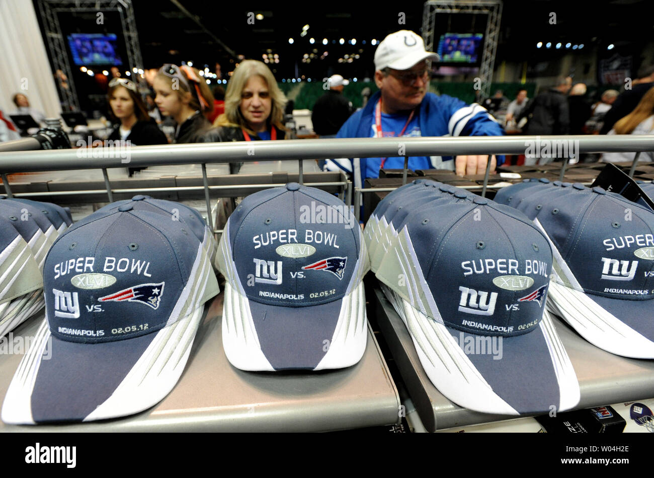 National Football League fans survey the souvenir items at the NFL shop at  the NFL Experience in the Indianapolis Convention Center in downtown  Indianapolis, Indiana on February 3, 2012. Hats cost $40.