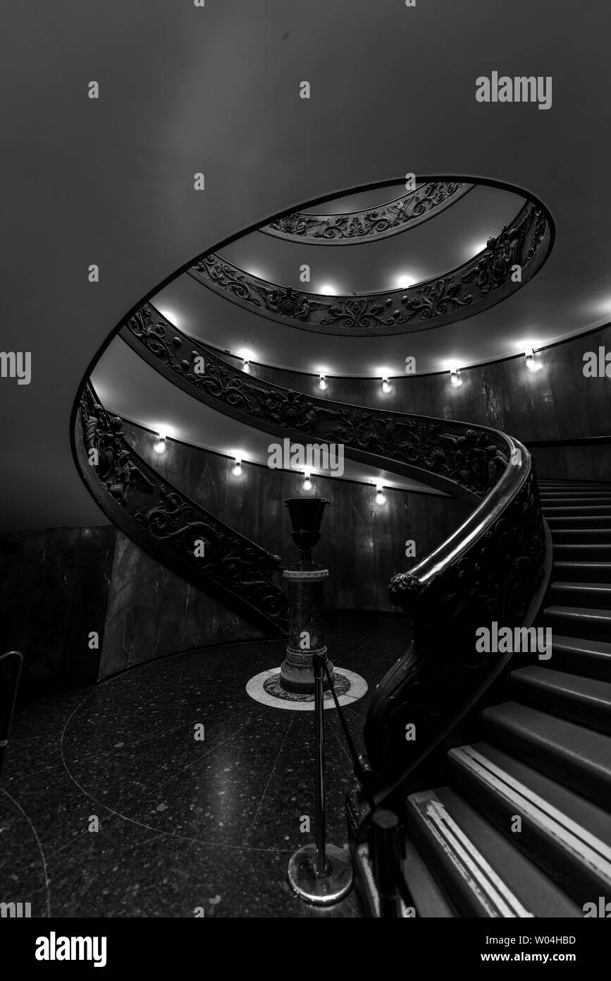 The lights shine in the dark. We observe a fountain typology, an imaginary one, in a dark, matte black background, with stairs leading to the unknown. Stock Photo