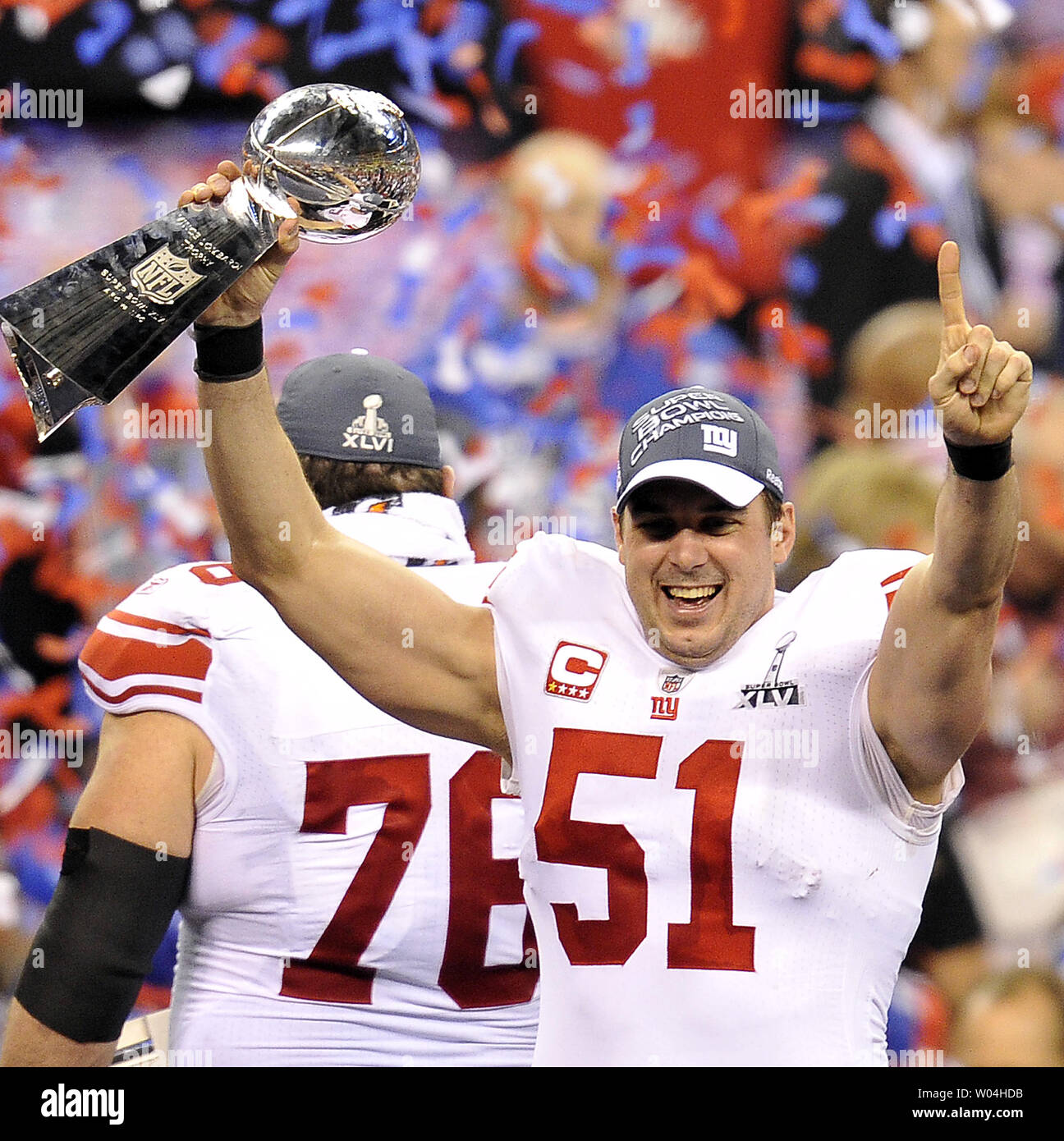 New York Giants long snapper Zak DeOssie hold the Vince Lombari trophy  after defeating the New England Patriots 21-17 to win Super Bowl XLVI  February 5, 2012, in Indianapolis. (UPI Photo/Brian Kersesy