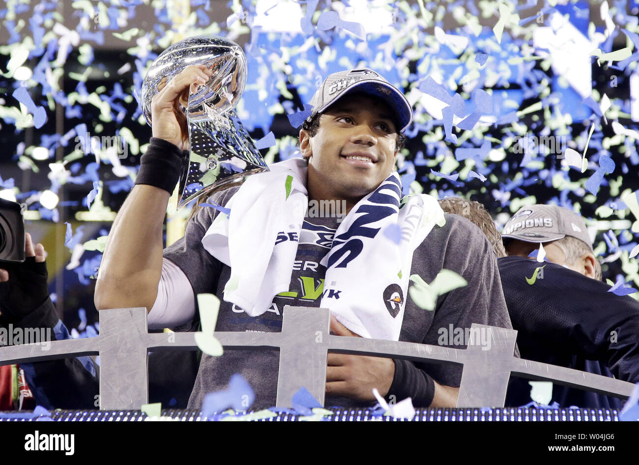 Seattle Seahawks quarterback Russell Wilson holds the Vince Lombardi trophy  after winning Super Bowl XLVIII at MetLife Stadium in East Rutherford, New  Jersey on February 2, 2014. Seattle beat Denver 43-8 to