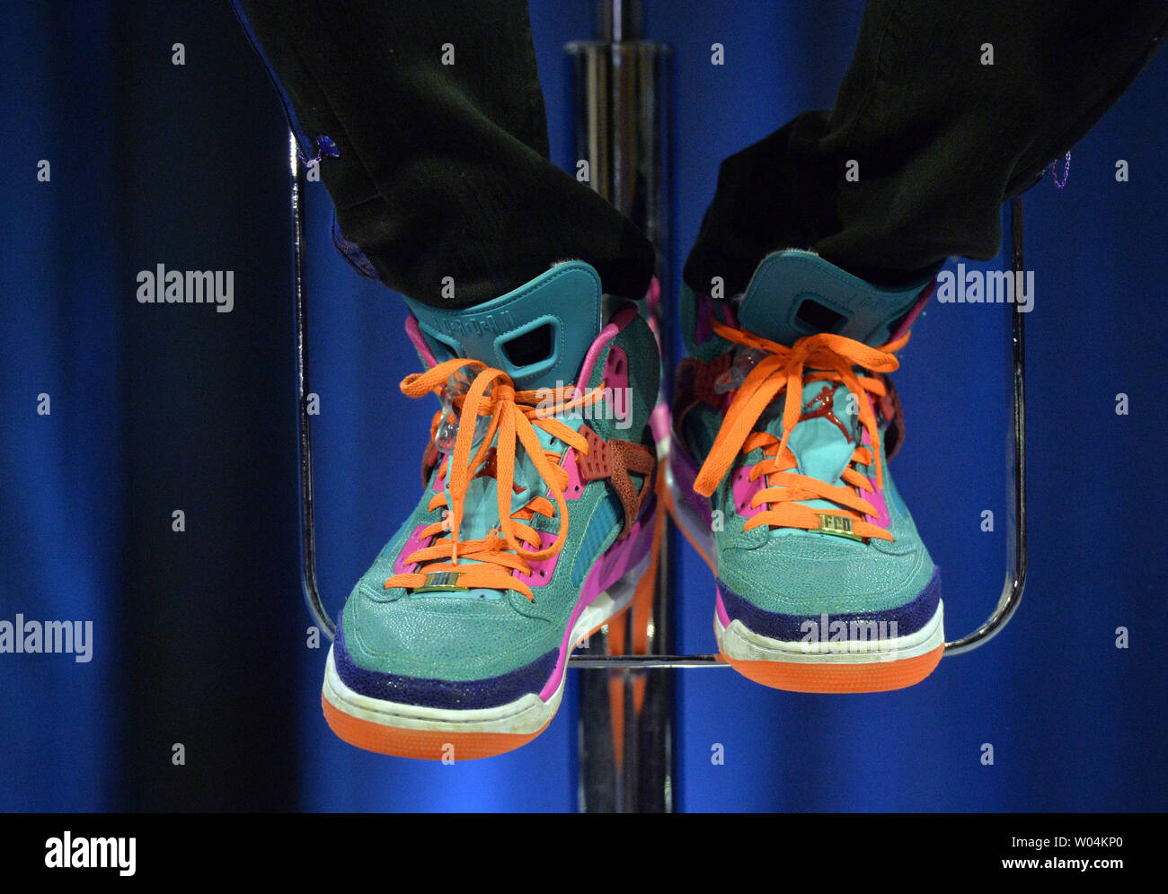 Coldplay front man Chris Martin's custom shoes designed by his son are seen  as he speaks about the band's upcoming half time performance for Super Bowl  50 during a press conference in