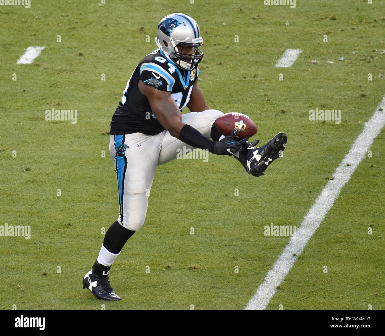 Carolina Panthers Kony Ealy (R) intercepts a pass from Denver Broncos Peyton Manning in the second quarter of Super Bowl 50 in Santa Clara, California on February 7, 2016.      Photo by Jon SooHooh/UPI Stock Photo