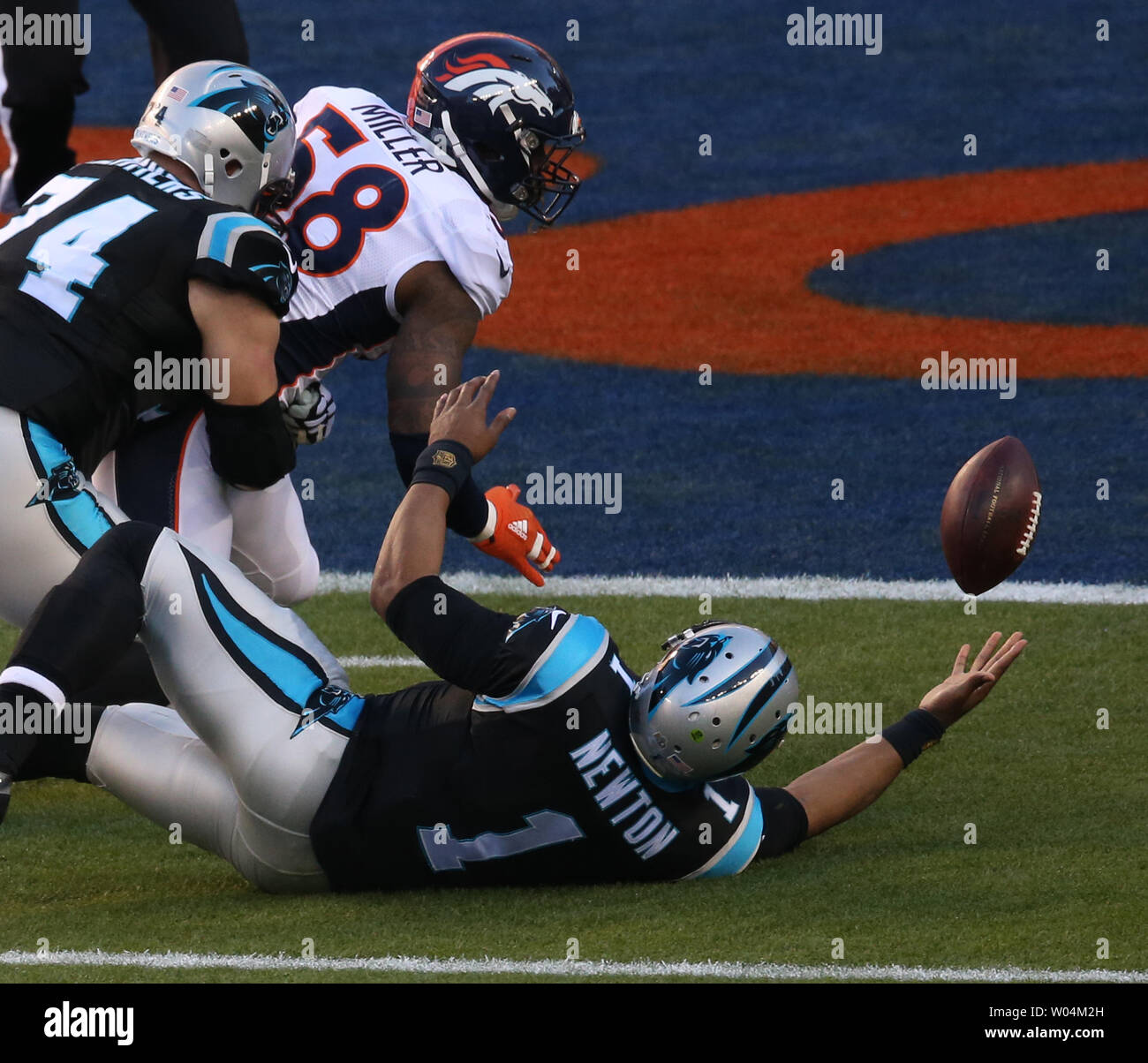 Carolina Panthers quarterback Cam Newton reaches fior his fumble forced by  Denver Broncos Von Miller that turned into a Broncos touchdown in the first  quarter of Super Bowl 50 in Santa Clara,