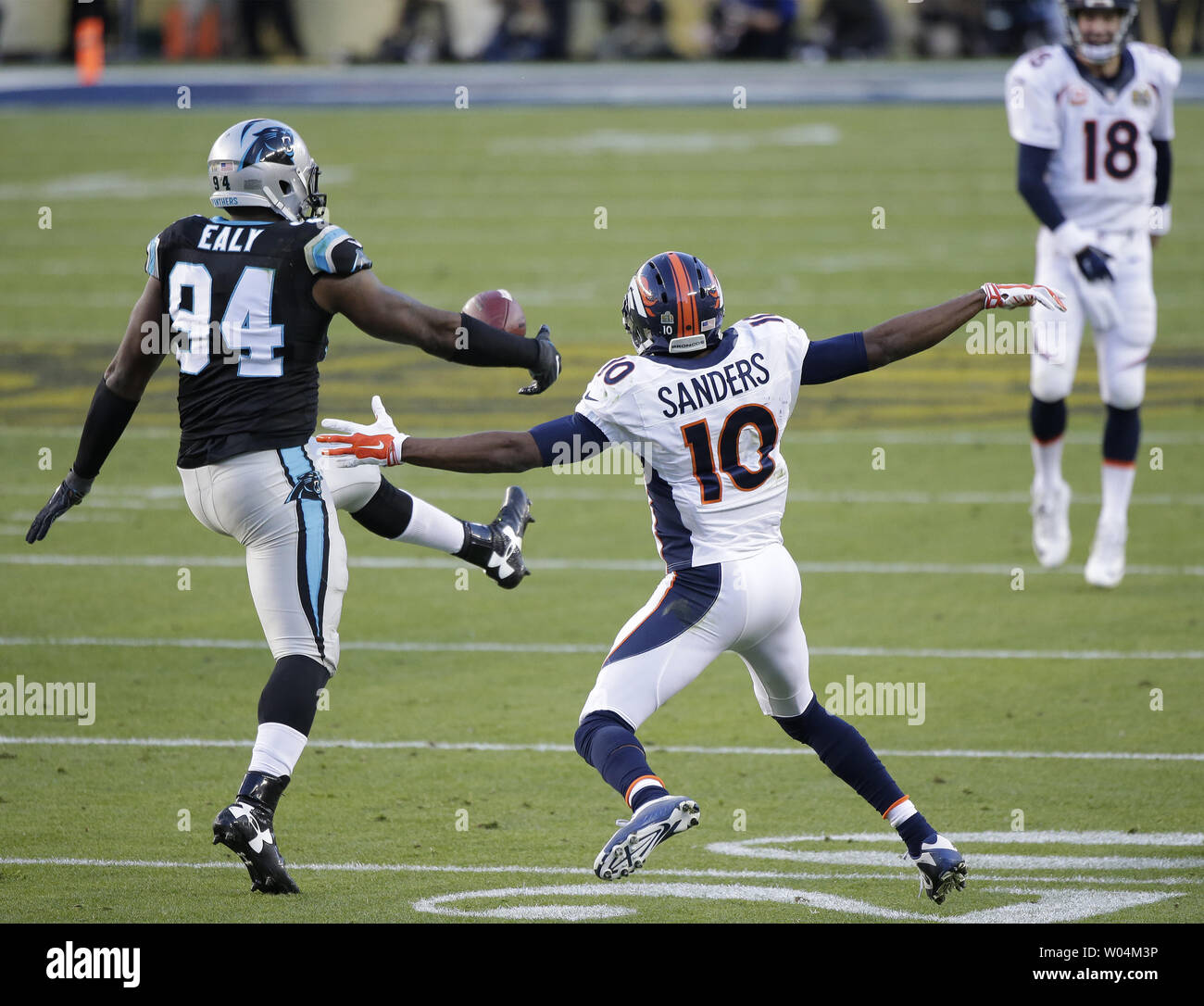 Carolina Panthers defensive end Kony Ealy (94) uses his leg to deflect and intercept a pass intended for Denver Broncos Emmanuel Sanders (10) in the second quarter during Super Bowl 50 at Levi's Stadium in Santa Clara, California on February 7, 2016.    Photo by John Angelillo/UPI Stock Photo