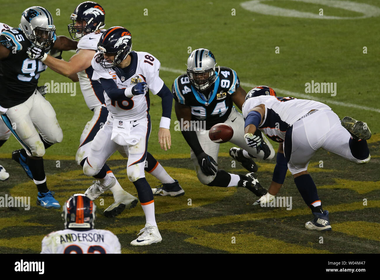 Carolina Panthers defensive end Kony Ealy (94) strips the ball away from Denver Broncos quarterback Peyton Manning (18) in the third quarter during Super Bowl 50 at Levi's Stadium in Santa Clara, California on February 7, 2016.    Photo by Bruce Gordon/UPI Stock Photo