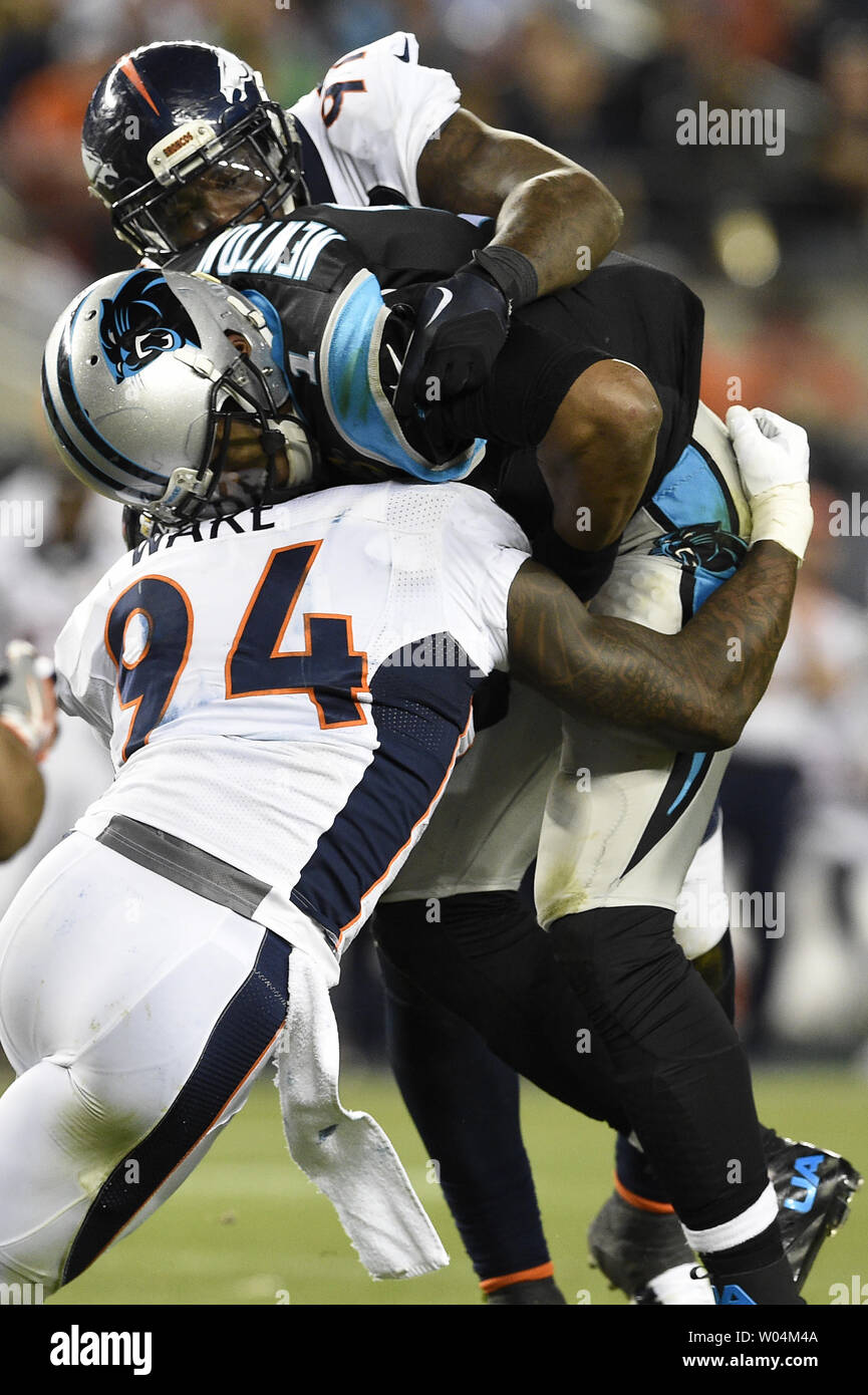 Denver Broncos DeMarcus Ware (94) and Malik Jackson wrap up