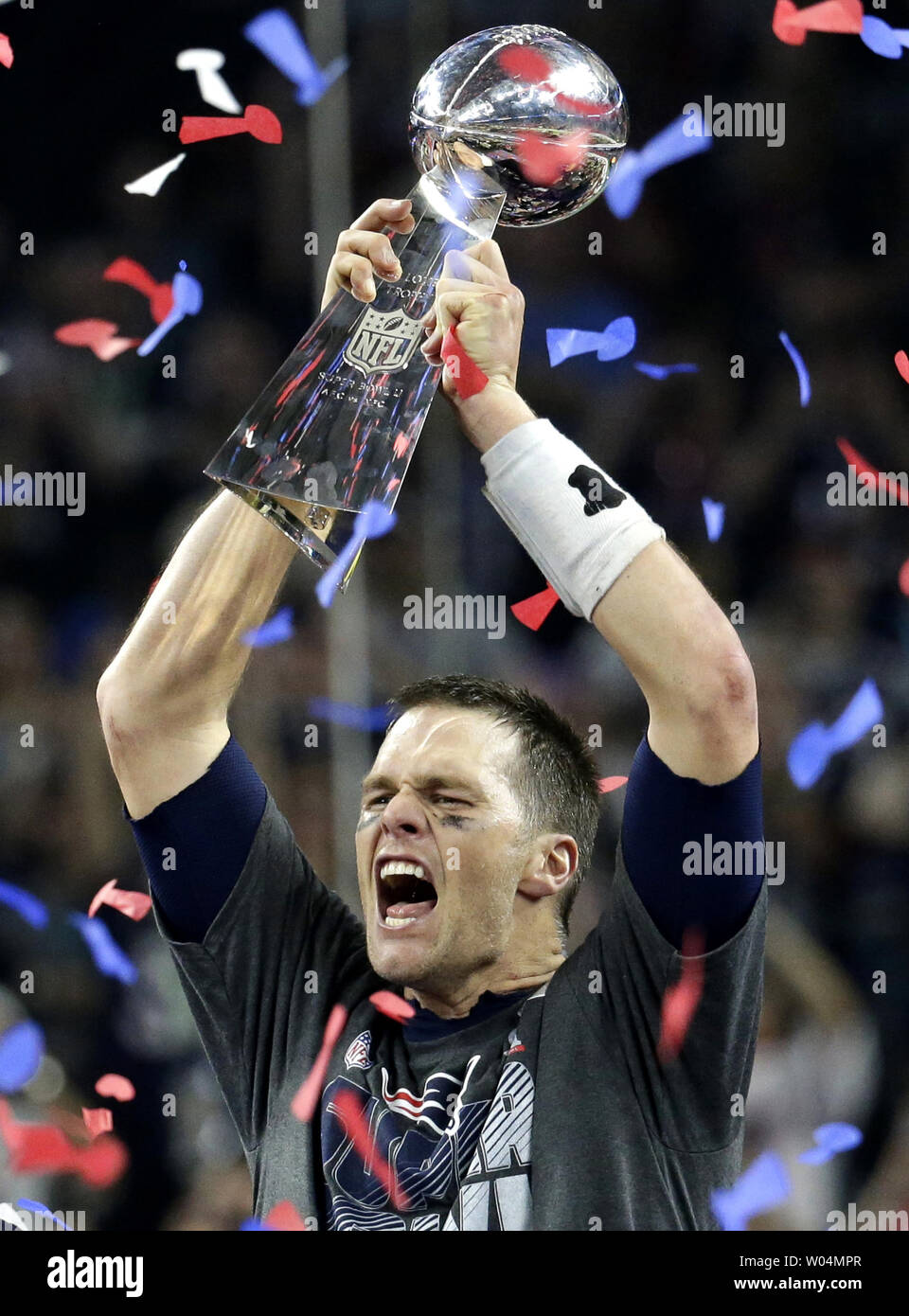New England Patriots quarterback Tom Brady (12) hoists the Vince Lombardi  trophy after the Patriots defeated the Atlanta Falcons 34-28 in overtime of Super  Bowl LI at NRG Stadium in Houston Texas