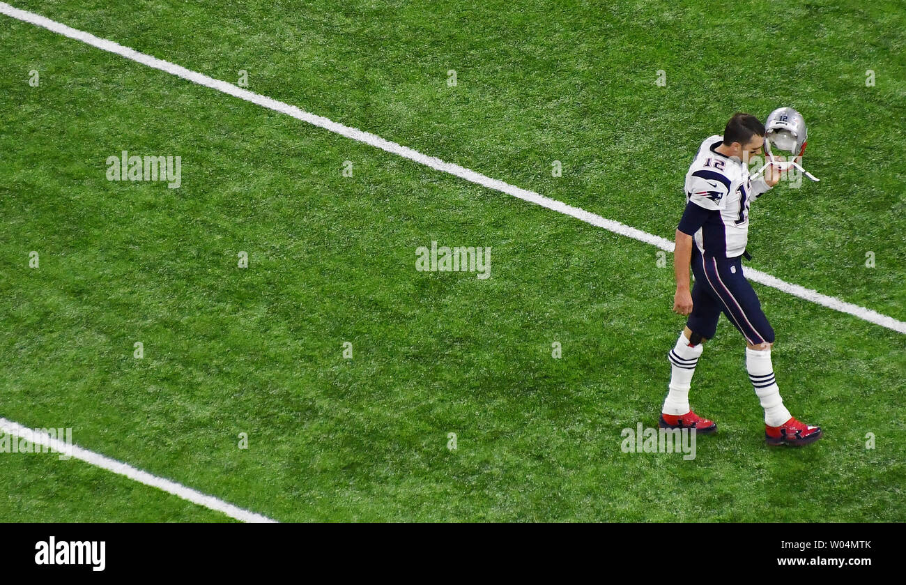 New England Patriots quarterback Tom Brady walks on the field