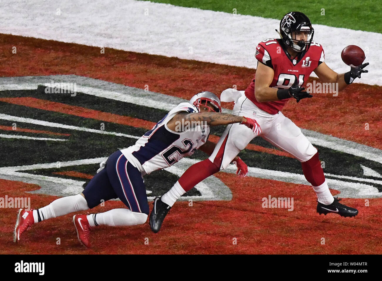 Atlanta Falcons tight end Austin Hooper (R) catches a 19-yard touchdown  pass against New England Patriots safety Patrick Chung during the second  quarter at Super Bowl LI at NRG Stadium in Houston,