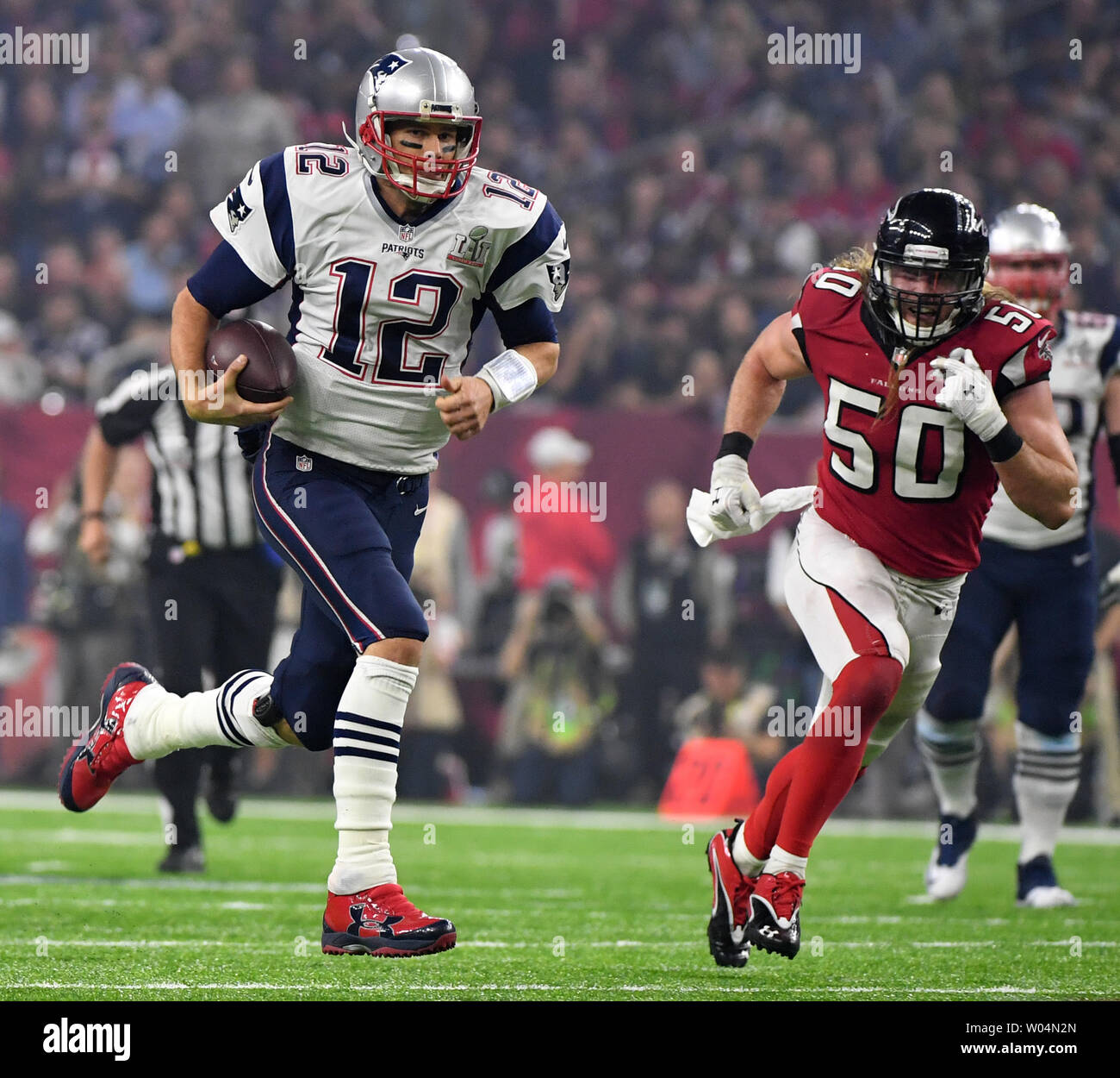 New England Patriots quarterback Tom Brady (L) and center David Andrews  celebrate after Super Bowl LI at NRG Stadiu…