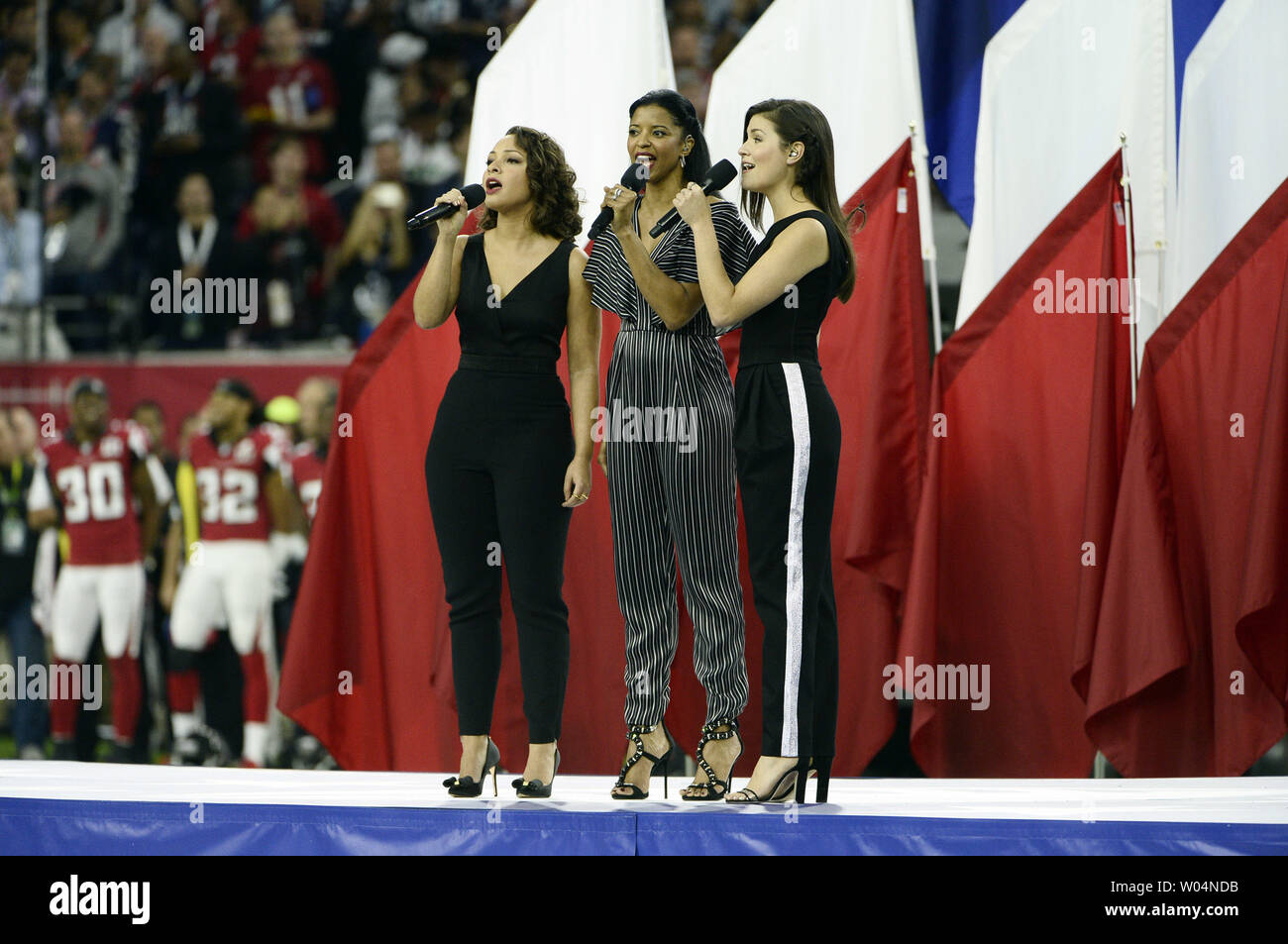 Jasmine Cephas Jones (L-R), Renee Elise Goldsberry and Phillipa Soo, the musical Hamilton's original Schuyler Sisters, sing America the Beautiful during pregame events before Super Bowl LI at NRG Stadium in Houston on February 5, 2017.     Photo by Brian Kersey/UPI Stock Photo