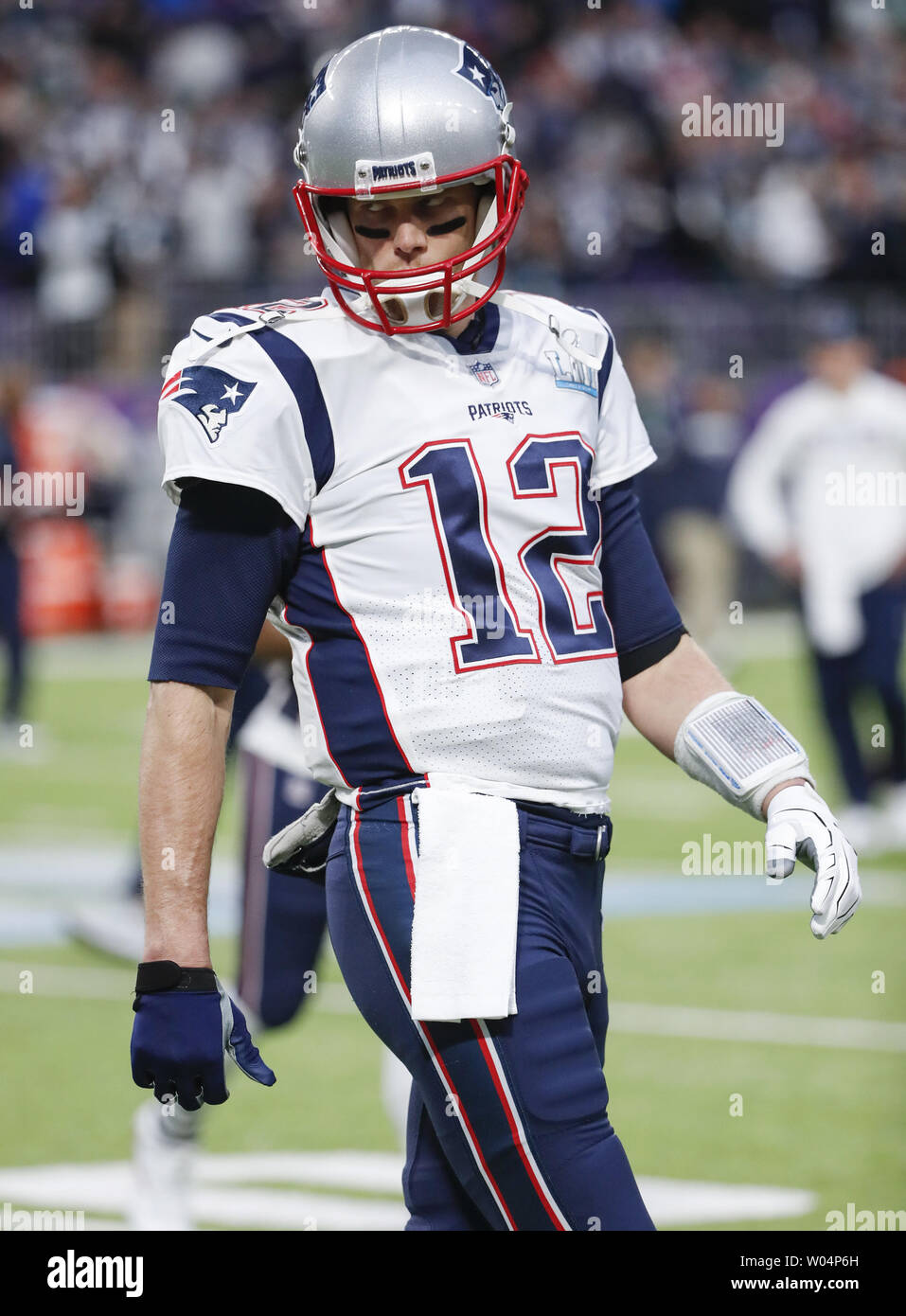 New England Patriots quarterback Tom Brady walks on the field before the Super  Bowl LII at U.S. Bank Stadium in Minneapolis, Minnesota on February 4, 2018.  The Eagles will be seeking their