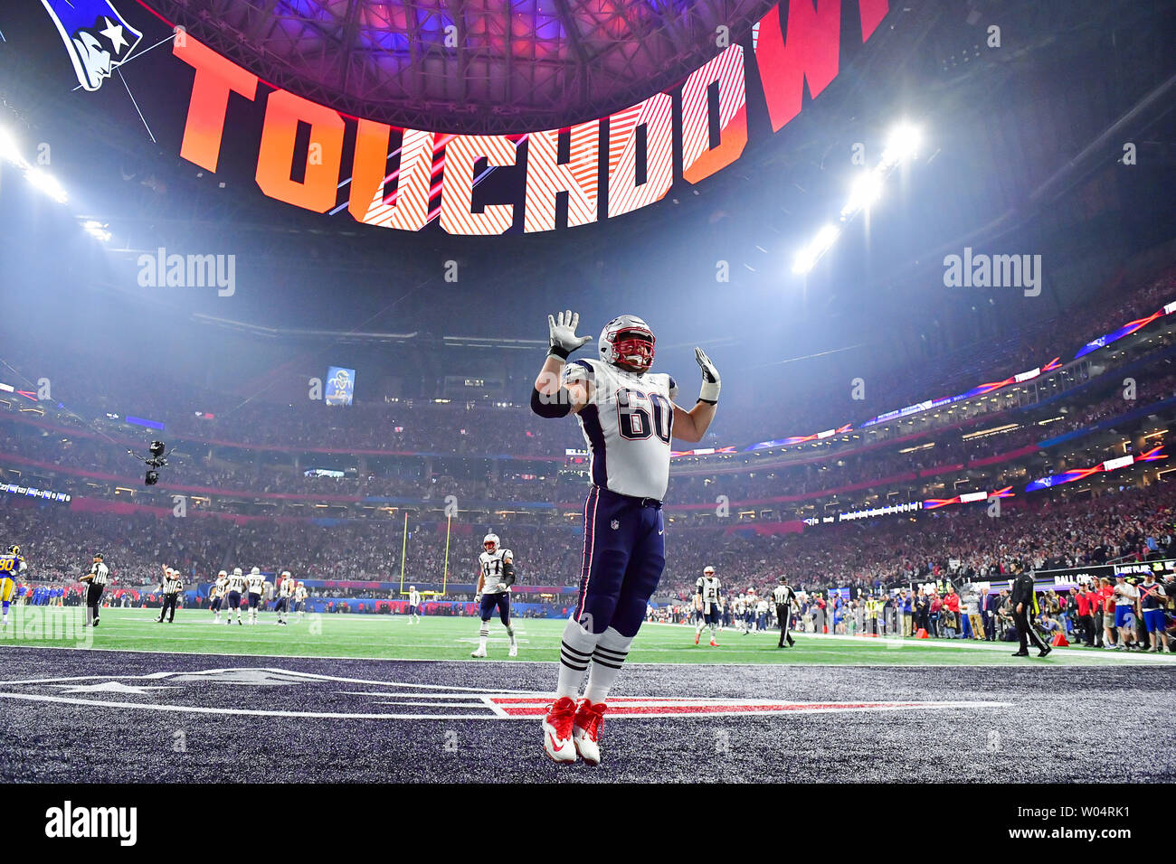 New England Patriots center David Andrews (60) celebrates a touchdown by  teammate Sony Michel (not pictured) in the fourth quarter of Super Bowl LIII  against the Los Angeles Rams at Mercedes-Benz Stadium