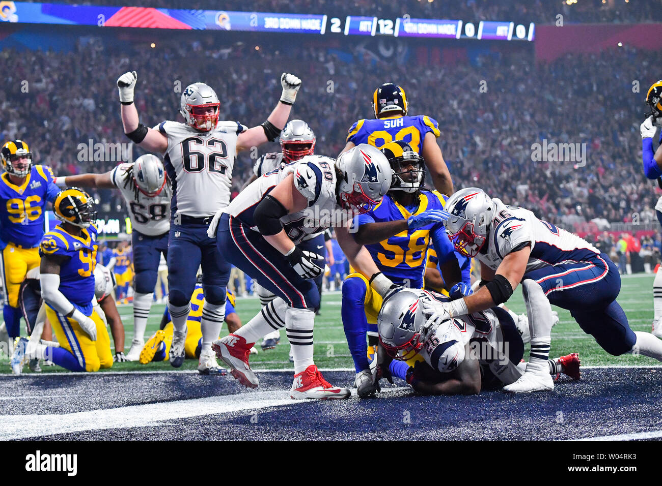 New England Patriots running back Sony Michel (26) is congratulated by teammates after a two-yard touchdown carry in the fourth quarter of Super Bowl LIII against the Los Angeles Rams at Mercedes-Benz Stadium on February 3, 2019 in Atlanta.  Photo by Kevin Dietsch/UPI Stock Photo