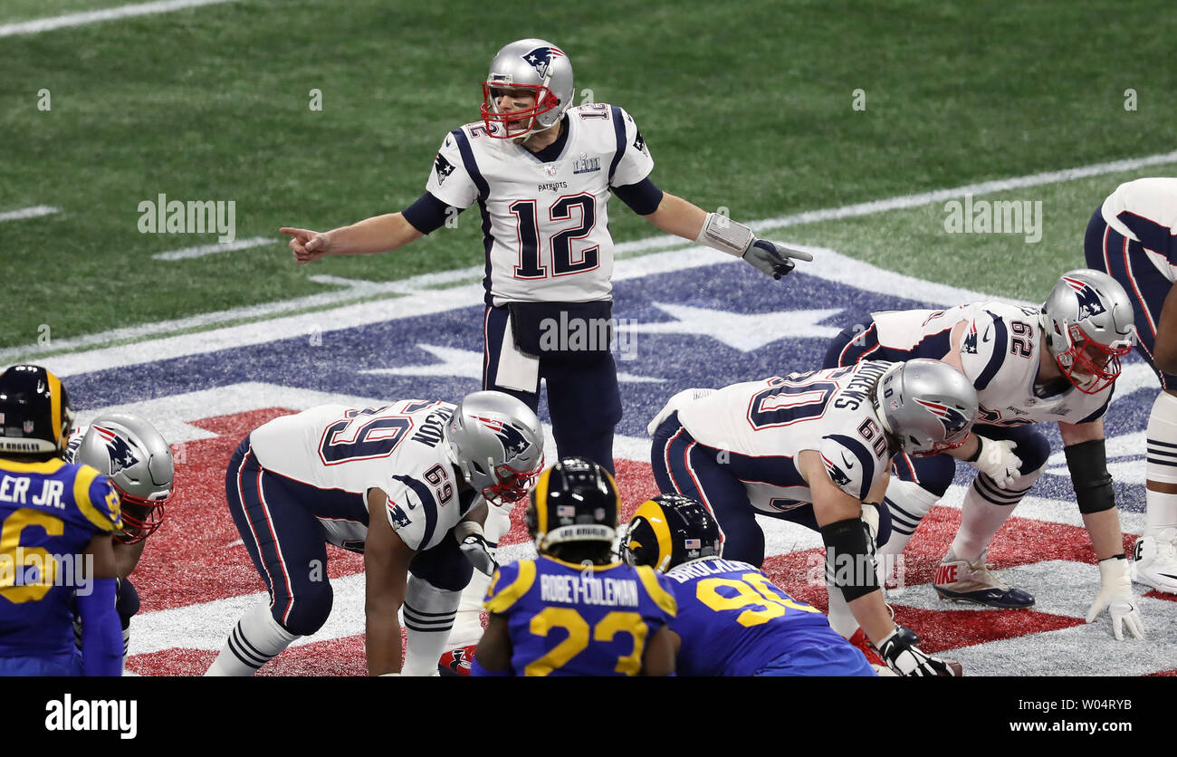 Patriot's quarterback Tom Brady (12) passes the time during pregame at  Super Bowl XXXVIII on February 1, 2004. The New England Patriots face the  Carolina Panthers at Reliant Stadium in Houston, Texas. (