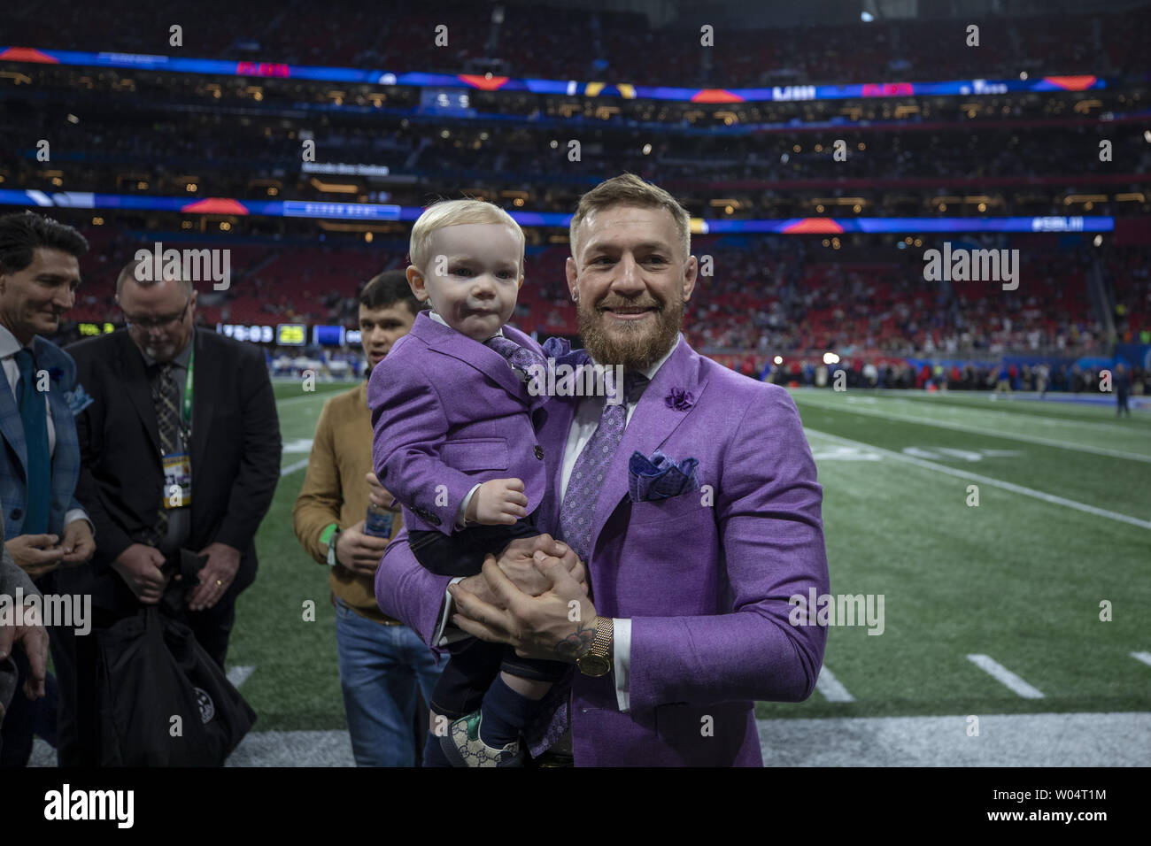 Conor Mcgregor holds his son Conor Jack McGregor Jr. pregame activities