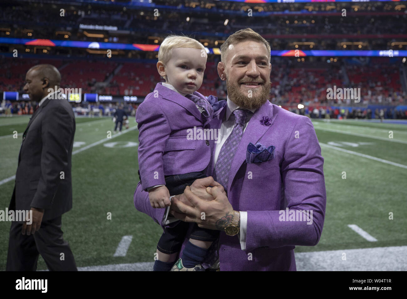Conor Mcgregor holds his son Conor Jack McGregor Jr. pregame activities