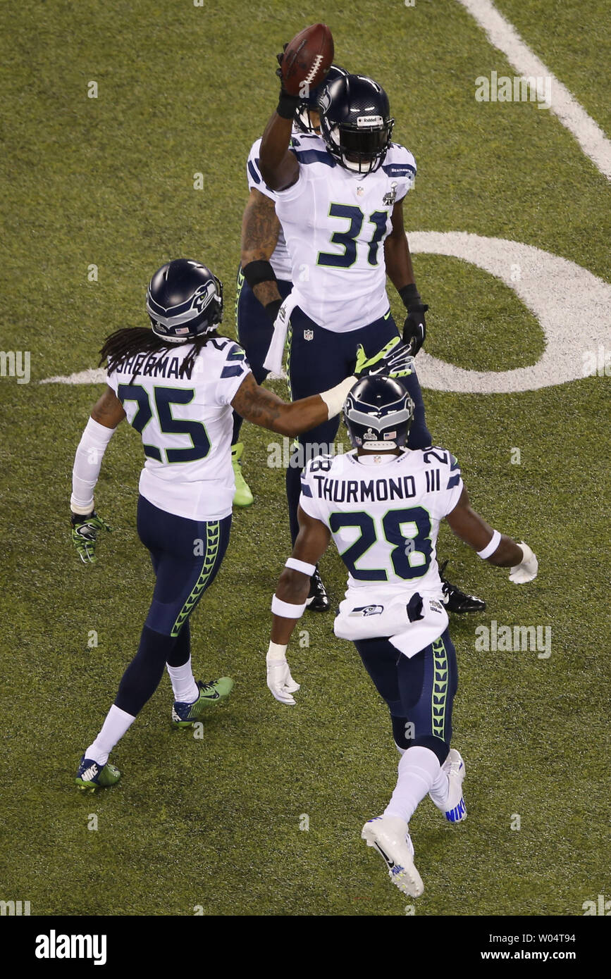 Seattle Seahawks strong safety Kam Chancellor 31 holds up the